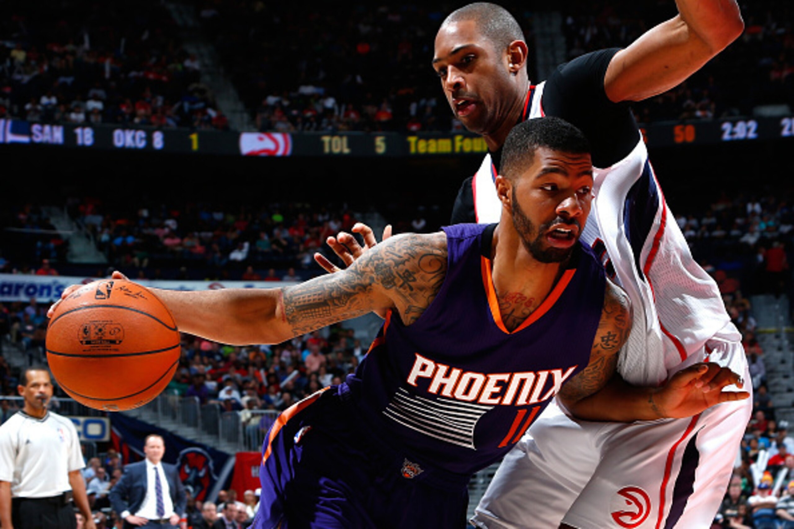 ATLANTA, GA - APRIL 07: Markieff Morris #11 of the Phoenix Suns drives against Al Horford #15 of the Atlanta Hawks at Philips Arena on April 7, 2015 in Atlanta, Georgia. NOTE TO USER: User expressly acknowledges and agrees that, by downloading and/or us ATLANTA, GA - APRIL 07: Markieff Morris #11 of the Phoenix Suns drives against Al Horford #15 of the Atlanta Hawks at Philips Arena on April 7, 2015 in Atlanta, Georgia. NOTE TO USER: User expressly acknowledges and agrees that, by downloading and/or us
