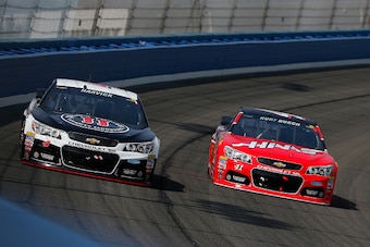 FONTANA, CA - MARCH 22:  Kevin Harvick, driver of the #4 Jimmy John's/Budweiser Chevrolet, leads Kurt Busch, driver of the #41 Haas Automation Chevrolet, during the NASCAR Sprint Cup Series Auto Club 400 at Auto Club Speedway on March 22, 2015 in Fontana,
