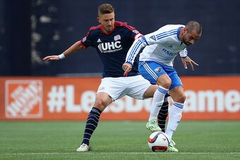 FOXBORO, MA - MARCH 21:  Andres Romero #15 of Montreal Impact shields the ball from Chris Tierney #8 of New England Revolution during the second half at Gillette Stadium on March 21, 2015 in Foxboro, Massachusetts.The Revolution and the Impact tied 0-0.  