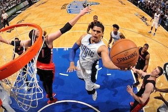 ORLANDO, FL - APRIL 10:  Tobias Harris #12 of the Orlando Magic goes up for a shot against the Toronto Raptors on April 10, 2015 at Amway Center in Orlando, Florida. NOTE TO USER: User expressly acknowledges and agrees that, by downloading and or using th