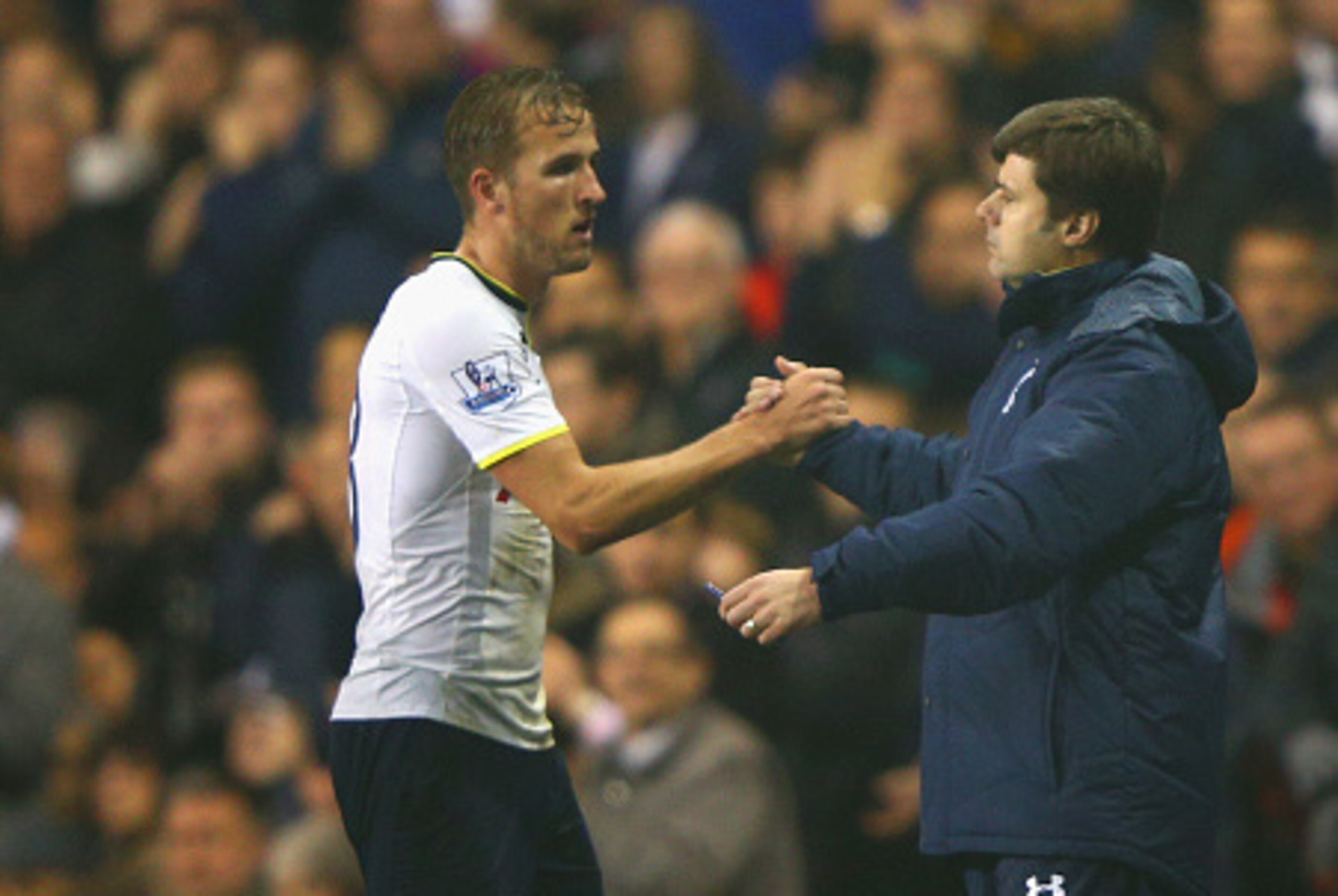 LONDON, ENGLAND - OCTOBER 29:  Harry Kane of Spurs shakes hands with Manager Mauricio Pochettino of Spurs during the Capital One Cup Fourth Round match Tottenham Hotspur and Brighton & Hove Albion at White Hart Lane on October 29, 2014 in London, England.
