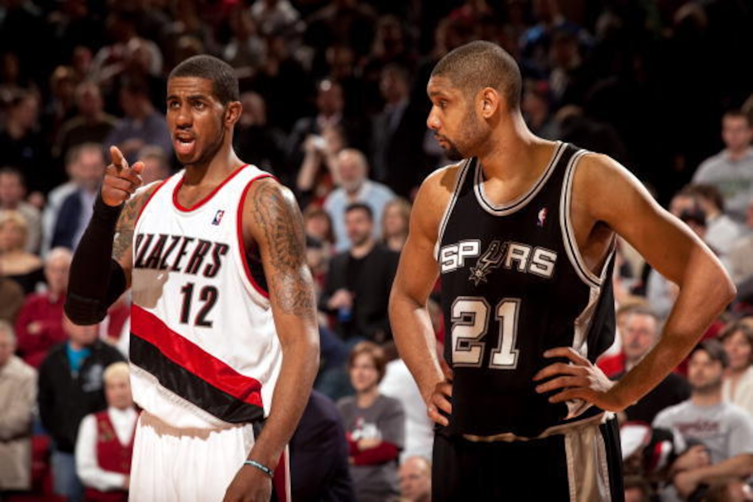 PORTLAND, OR - FEBRUARY 4:  LaMarcus Aldridge #12 of the Portland Trail Blazers and Tim Duncan #21 of the San Antonio Spurs on the court during the game at The Rose Garden on February 4, 2010 in Portland, Oregon. The Blazers won 96-93.  NOTE TO USER: User