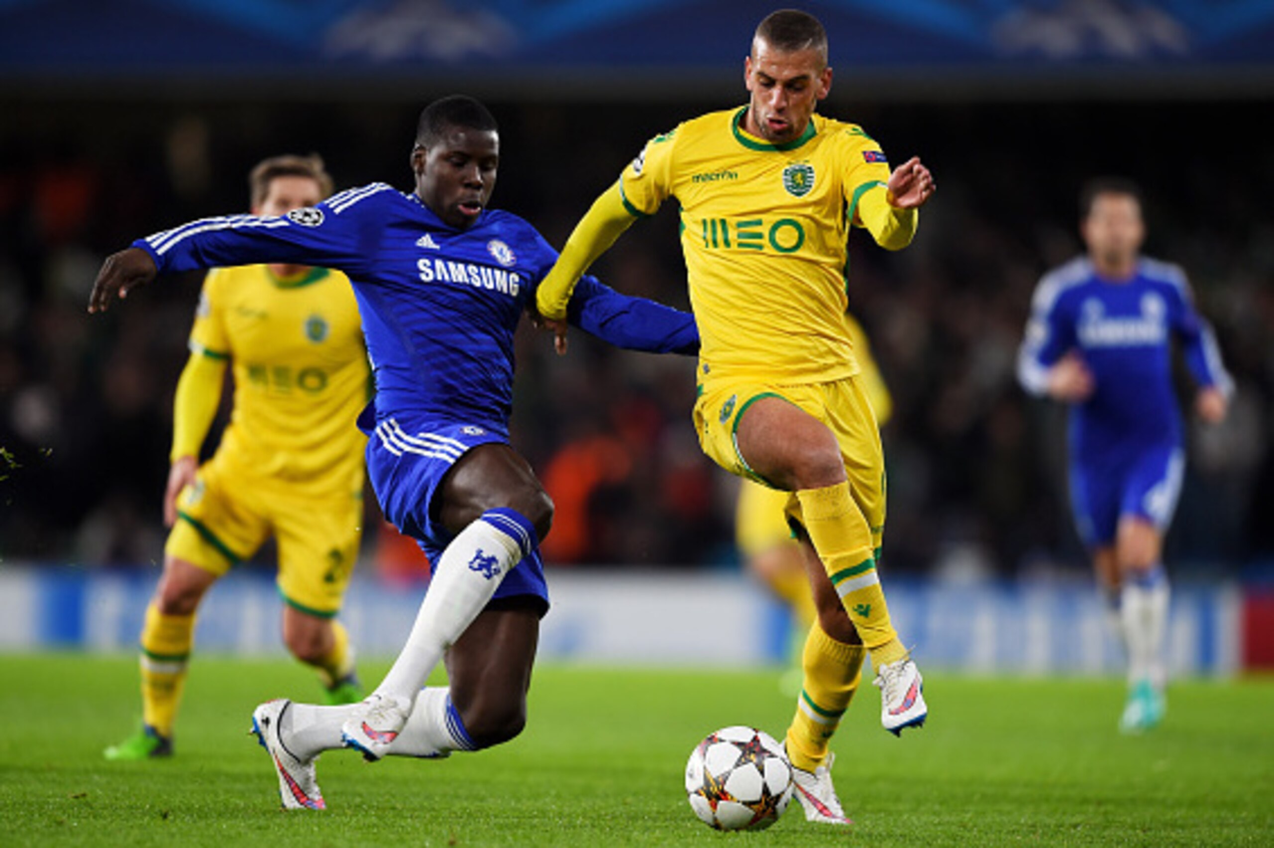 LONDON, ENGLAND - DECEMBER 10:  Islam Slimani of Sporting Lisbon is tackled by Kurt Zouma of Chelsea during the UEFA Champions League group G match between Chelsea and Sporting Clube de Portugal at Stamford Bridge on December 10, 2014 in London, United Ki