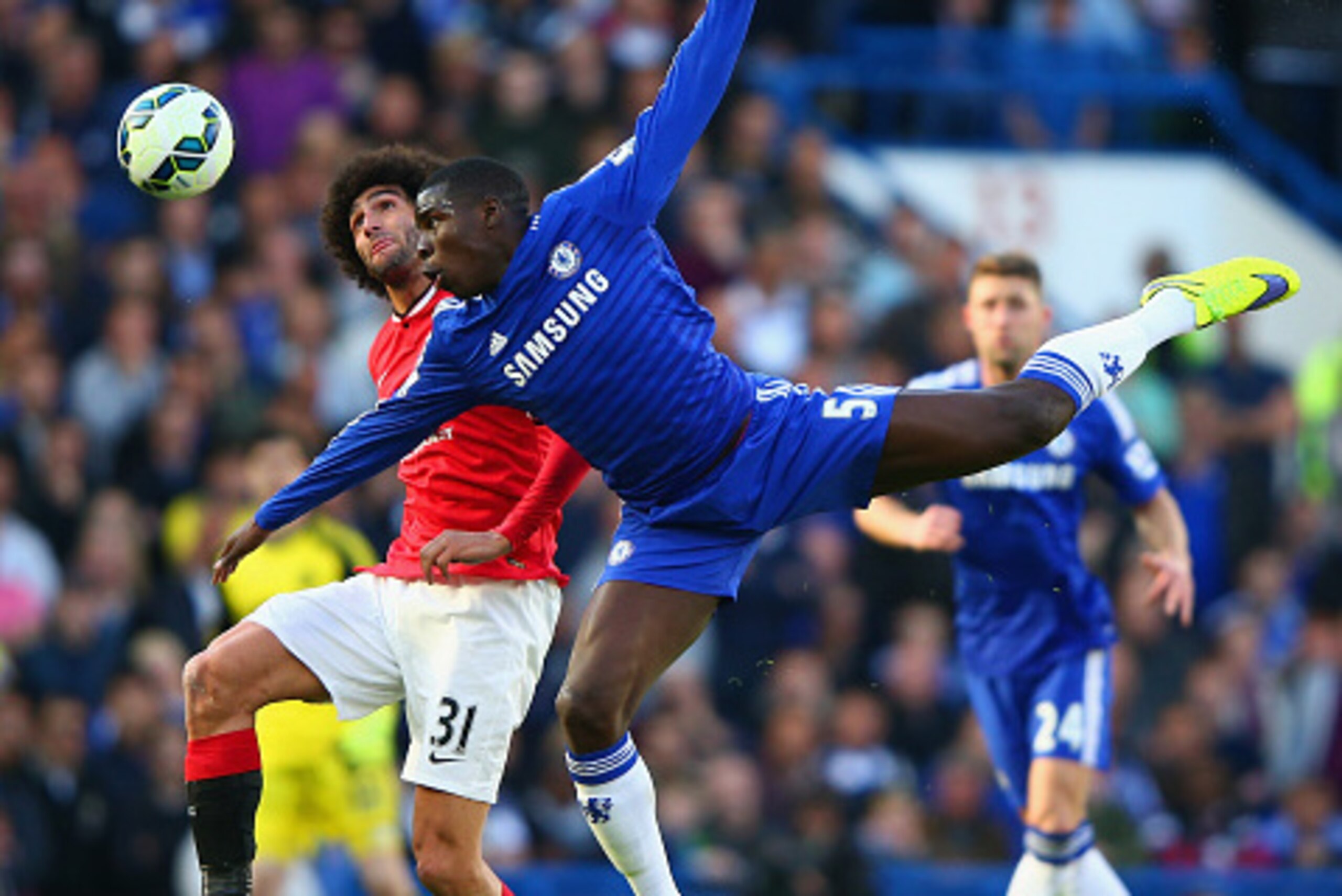 LONDON, ENGLAND - APRIL 18:  Marouane Fellaini of Manchester United and Kurt Zouma of Chelsea battle for the ball during the Barclays Premier League match between Chelsea and Manchester United at Stamford Bridge on April 18, 2015 in London, England.  (Pho