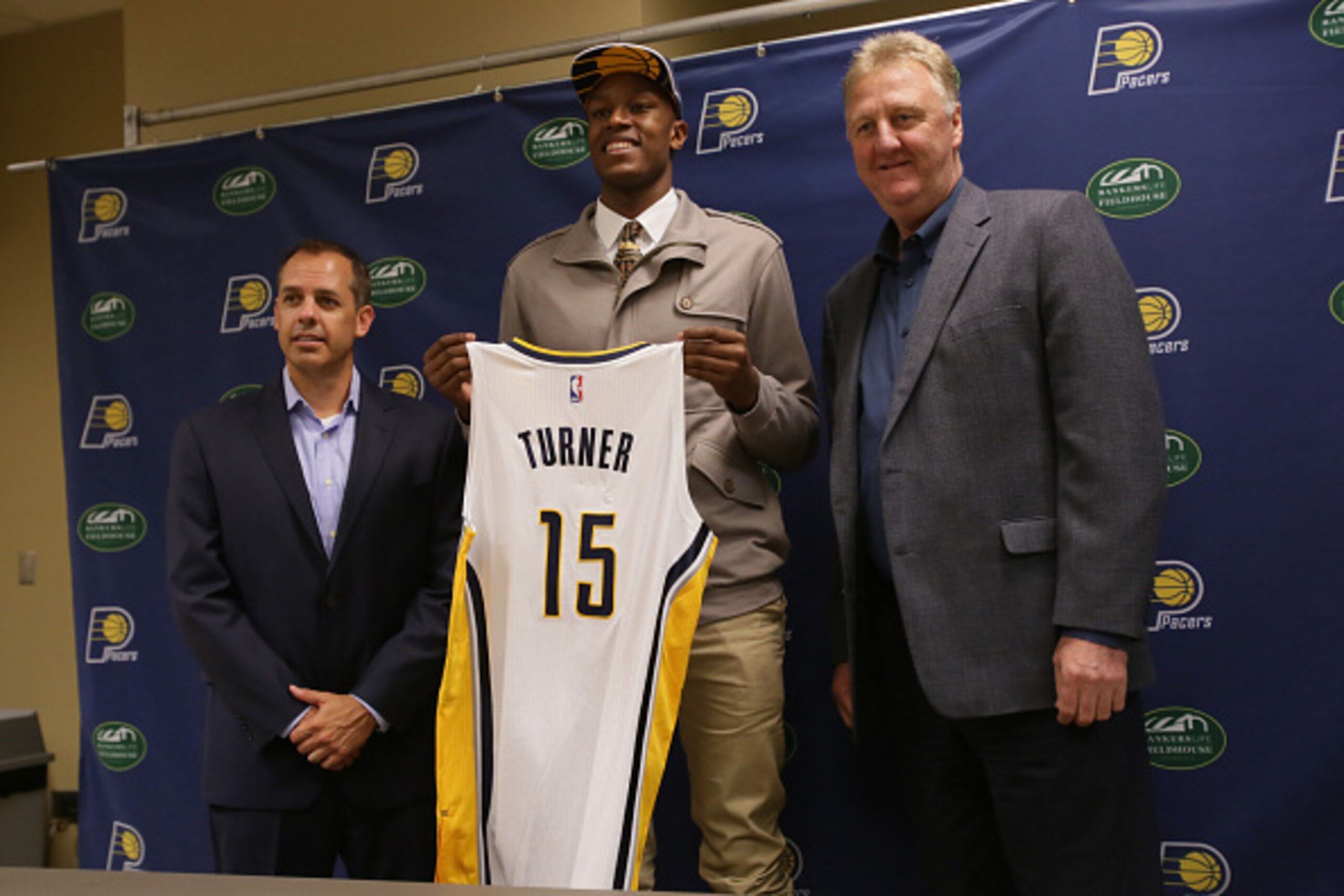 INDIANAPOLIS, IN - JUNE 26: Myles Turner, first round draft pick of the Indiana Pacers along Pacers head coach Frank Vogel and Pacers President Larry Bird take questions from the media on June 20, 2015 at Bankers Life Fieldhouse in Indianapolis, Indiana. INDIANAPOLIS, IN - JUNE 26: Myles Turner, first round draft pick of the Indiana Pacers along Pacers head coach Frank Vogel and Pacers President Larry Bird take questions from the media on June 20, 2015 at Bankers Life Fieldhouse in Indianapolis, Indiana.