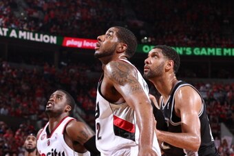 PORTLAND, OR - MAY 12:  LaMarcus Aldridge #12 of the Portland Trail Blazers boxes out Tim Duncan #21 of the San Antonio Spurs in Game Four of the Western Conference Semifinals during the 2014 NBA Playoffs on May 12, 2014 at the Moda Center in Portland, Or