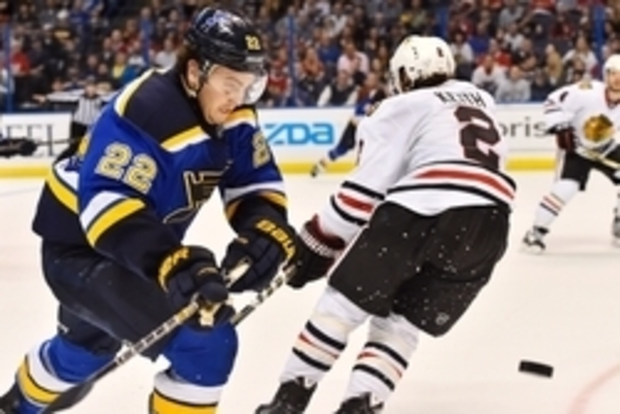 Apr 9, 2015; St. Louis, MO, USA; St. Louis Blues defenseman Kevin Shattenkirk (22) chases the puck against the Chicago Blackhawks during the second period at Scottrade Center. Mandatory Credit: Jasen Vinlove-USA TODAY Sports