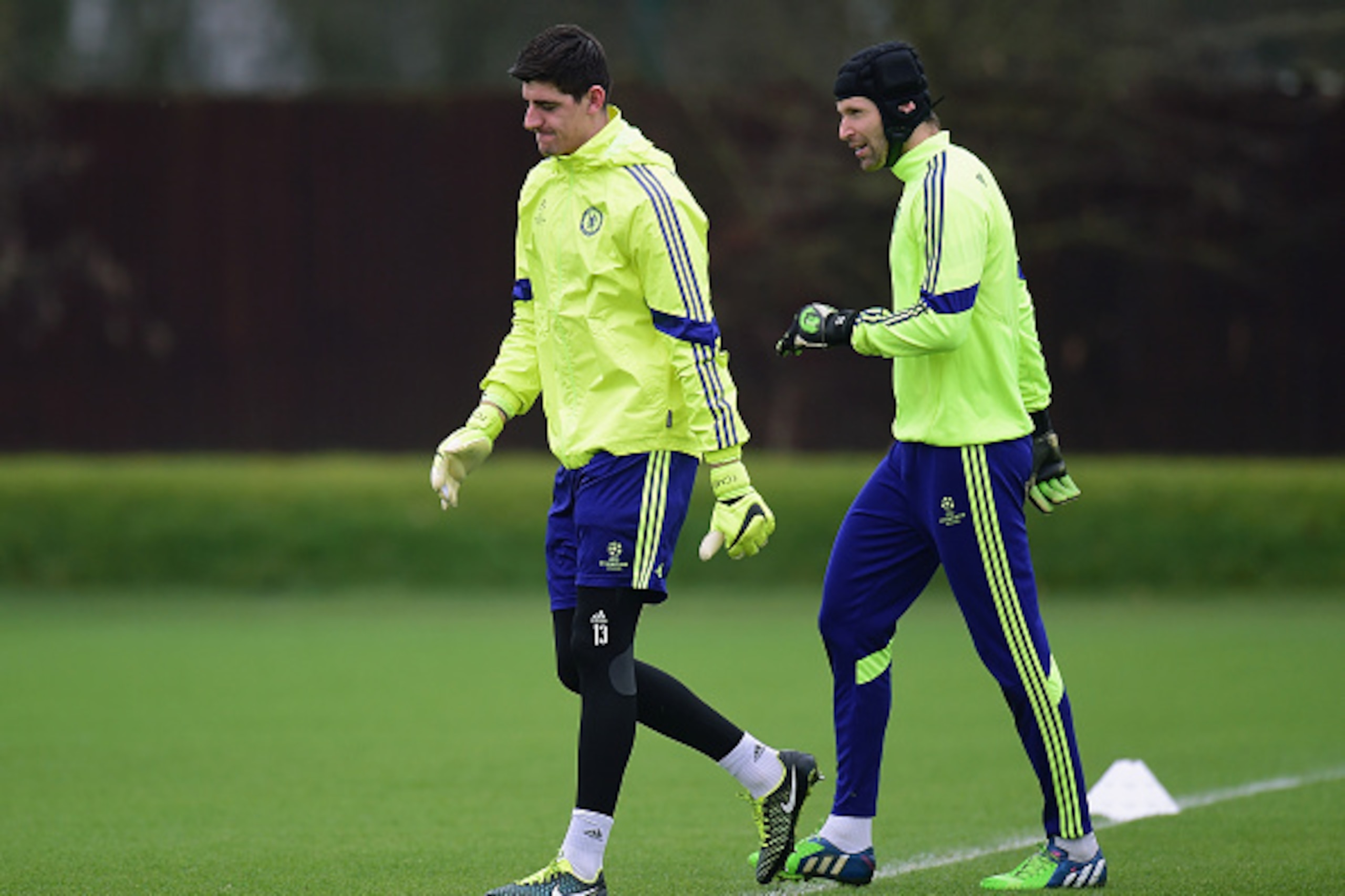 LONDON, ENGLAND - FEBRUARY 16: Thibaut Courtois and Petr Cech of Chelsea talk during a Chelsea training session ahead of the UEFA Champions League round of 16 match against Paris Saint-Germain at Cobham Training Centre on February 16, 2015 in London, Uni LONDON, ENGLAND - FEBRUARY 16: Thibaut Courtois and Petr Cech of Chelsea talk during a Chelsea training session ahead of the UEFA Champions League round of 16 match against Paris Saint-Germain at Cobham Training Centre on February 16, 2015 in London, Uni