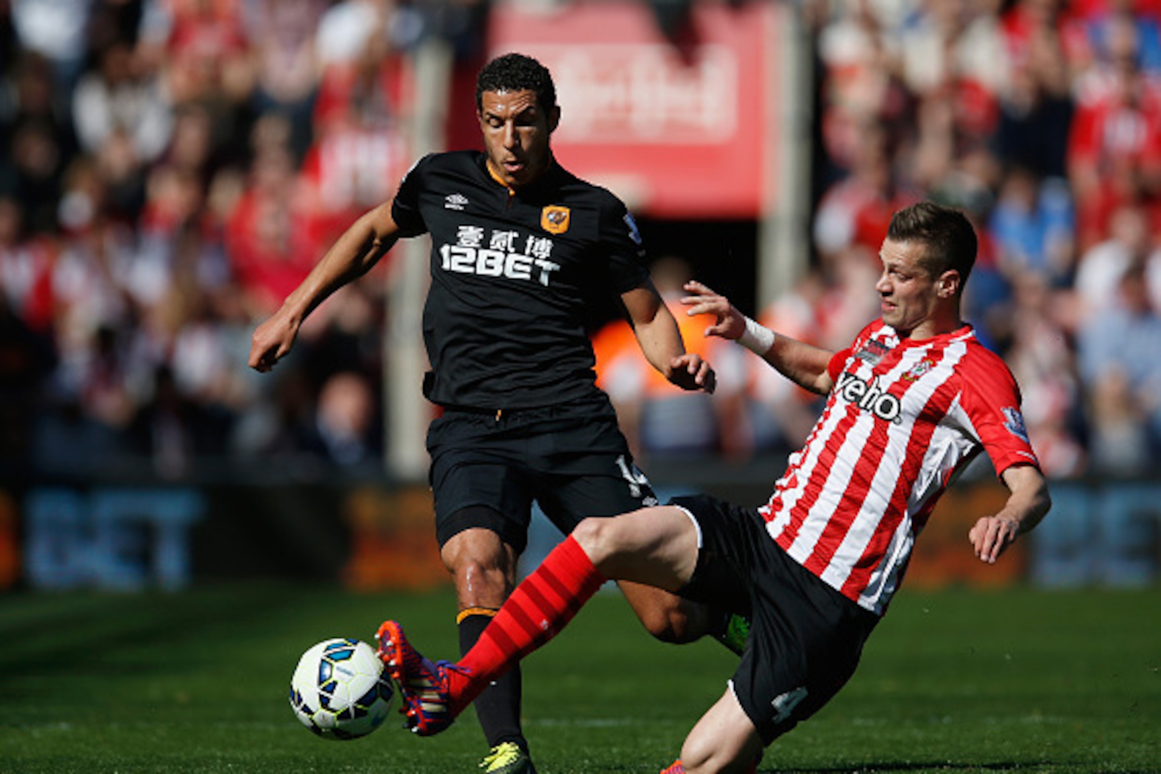 SOUTHAMPTON, ENGLAND - APRIL 11:  Morgan Schneiderlin of Southampton tackles Jake Livermore of Hull City during the Barclays Premier League match between Southampton and Hull City at St Mary's Stadium on April 11, 2015 in Southampton, England.  (Photo by 