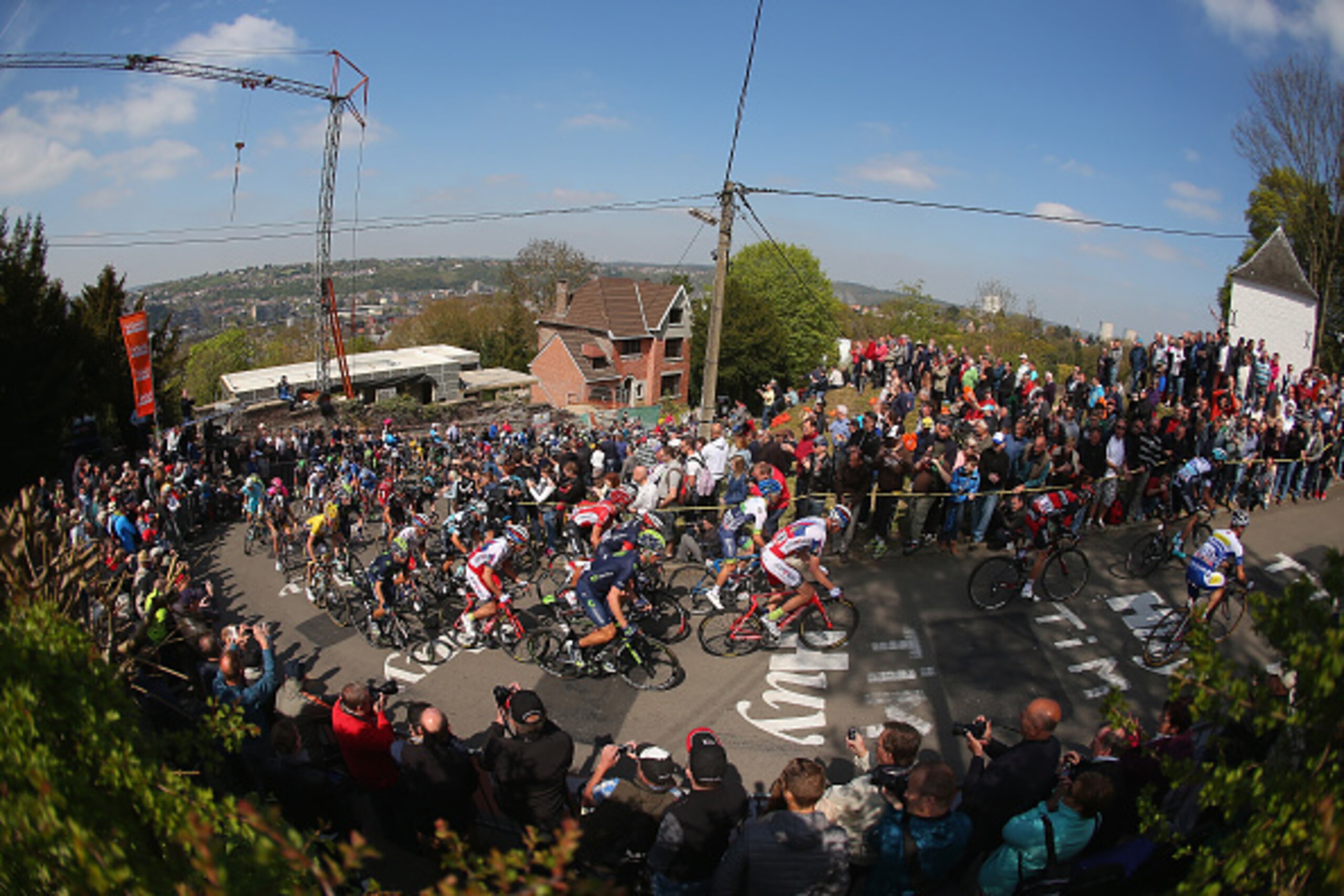 HUY, BELGIUM - APRIL 22:  Riders climb the Mur de Huy during the 79th La Fleche Wallonne from Waremme to Huy on April 22, 2015 in Huy, Belgium.  (Photo by Bryn Lennon/Getty Images)