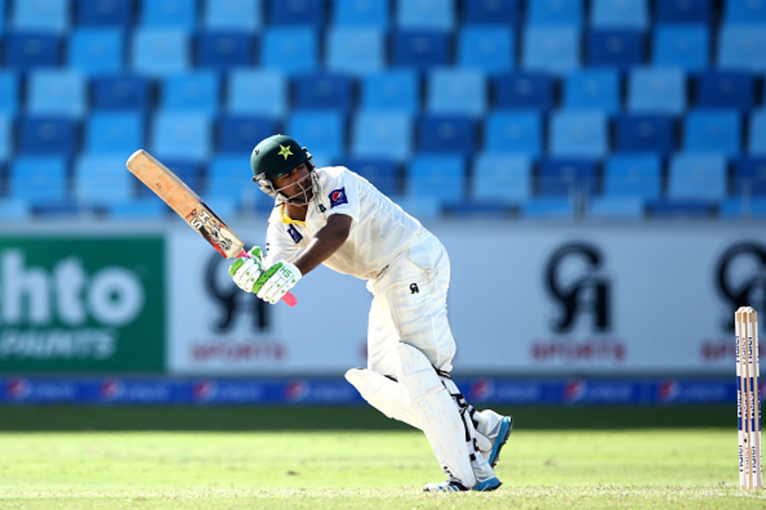 DUBAI, UNITED ARAB EMIRATES - OCTOBER 23:  Sarfraz Ahmed of Pakistan in action during Day Two of the First Test between Pakistan and Australia at Dubai International Stadium at Dubai International Stadium on October 23, 2014 in Dubai, United Arab Emirates
