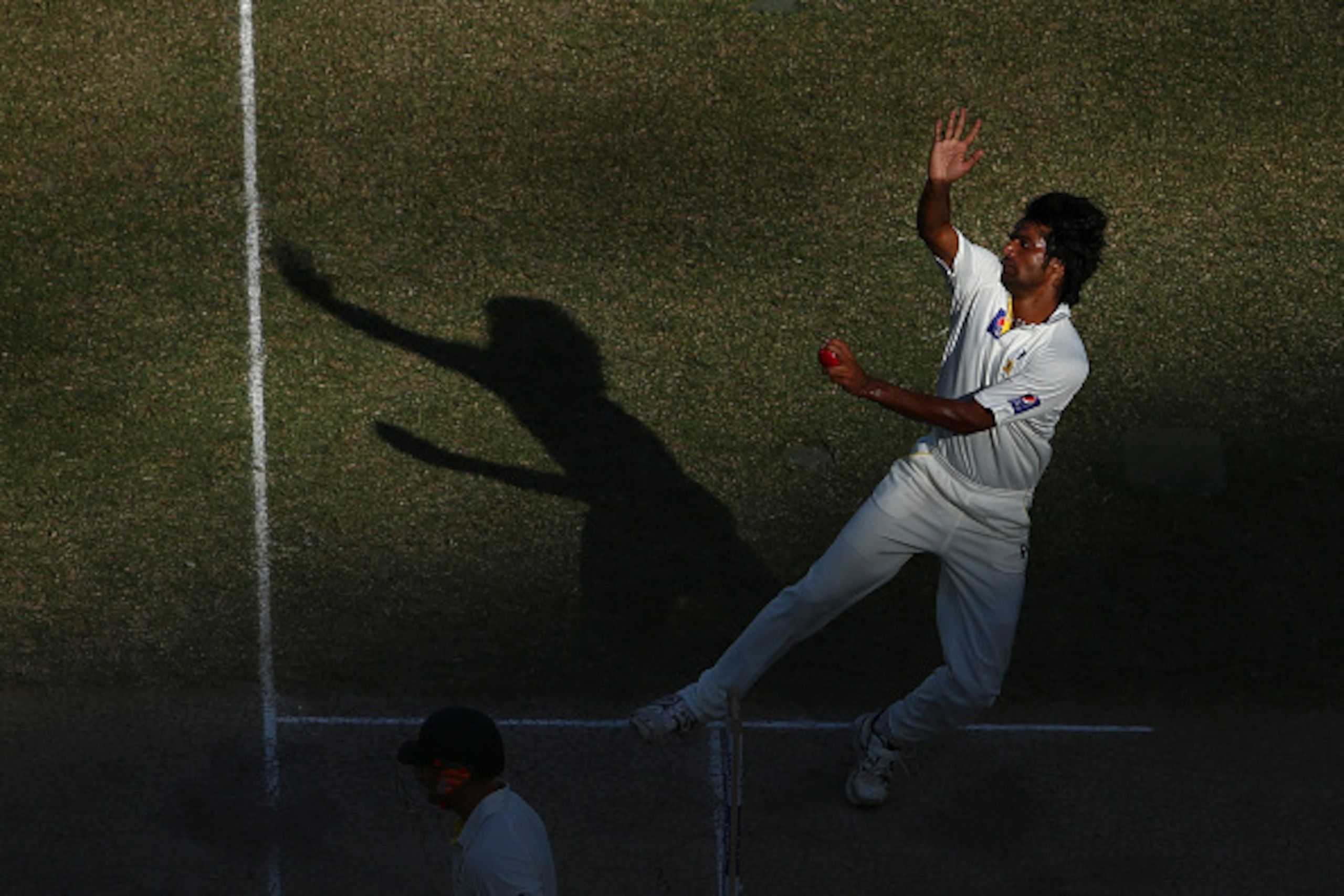 DUBAI, UNITED ARAB EMIRATES - OCTOBER 23:  Rahat Ali of Pakistan bowls during Day Two of the First Test between Pakistan and Australia at Dubai International Stadium on October 23, 2014 in Dubai, United Arab Emirates.  (Photo by Ryan Pierse/Getty Images)
