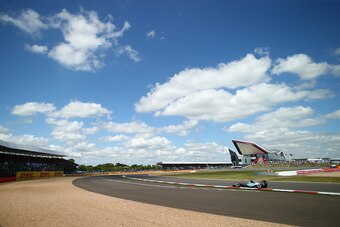NORTHAMPTON, ENGLAND - JULY 04:  Lewis Hamilton of Great Britain and Mercedes GP drives during qualifying for the Formula One Grand Prix of Great Britain at Silverstone Circuit on July 4, 2015 in Northampton, England.  (Photo by Clive Rose/Getty Images)