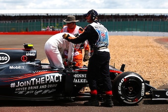 NORTHAMPTON, ENGLAND - JULY 05:  Jenson Button of Great Britain and McLaren Honda climbs out of his car after retiring in the Formula One Grand Prix of Great Britain at Silverstone Circuit on July 5, 2015 in Northampton, England.  (Photo by Dan Istitene/G