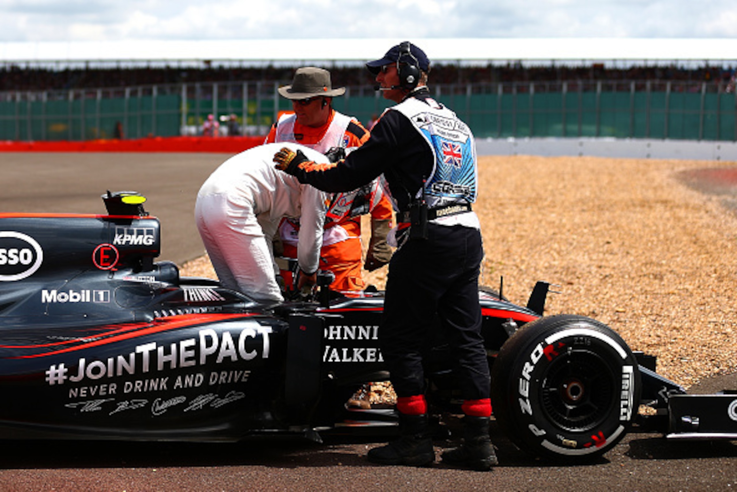 NORTHAMPTON, ENGLAND - JULY 05: Jenson Button of Great Britain and McLaren Honda climbs out of his car after retiring in the Formula One Grand Prix of Great Britain at Silverstone Circuit on July 5, 2015 in Northampton, England. (Photo by Dan Istitene/G NORTHAMPTON, ENGLAND - JULY 05: Jenson Button of Great Britain and McLaren Honda climbs out of his car after retiring in the Formula One Grand Prix of Great Britain at Silverstone Circuit on July 5, 2015 in Northampton, England. (Photo by Dan Istitene/G