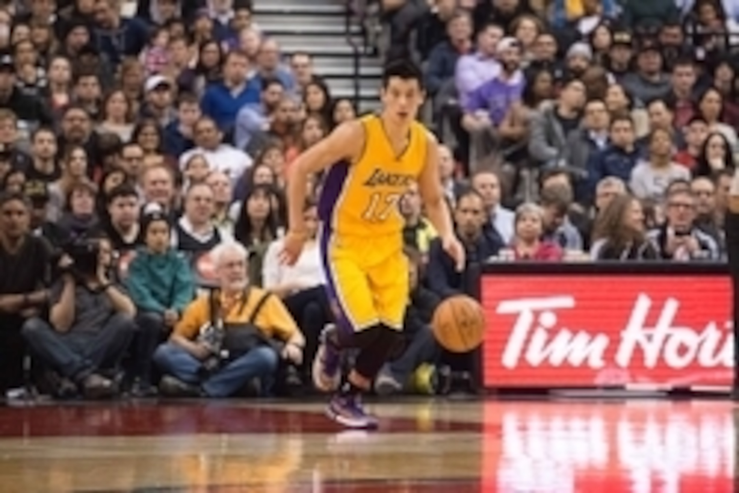 Mar 27, 2015; Toronto, Ontario, Los Angeles Lakers guard Jeremy Lin (17) takes the ball up court during the first quarter in a game against the Toronto Raptors at Air Canada Centre. The Toronto Raptors won 94-83. Mandatory Credit: Nick Turchiaro-USA TODAY
