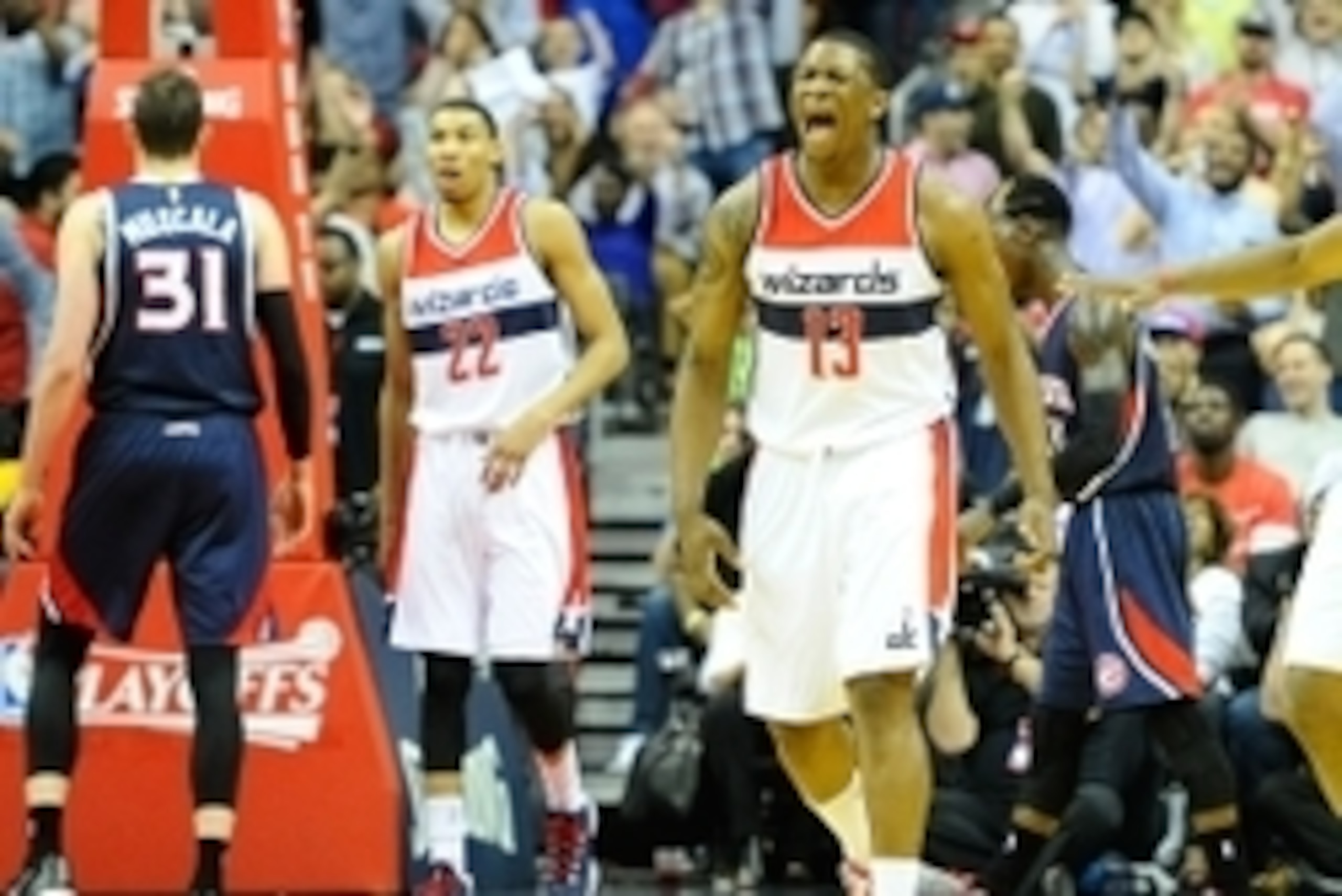 May 15, 2015; Washington, DC, USA; Washington Wizards center Kevin Seraphin (13) reacts after scoring a basket against the Atlanta Hawks during the first half in game six of the second round of the NBA Playoffs at Verizon Center. Mandatory Credit: Brad Mi