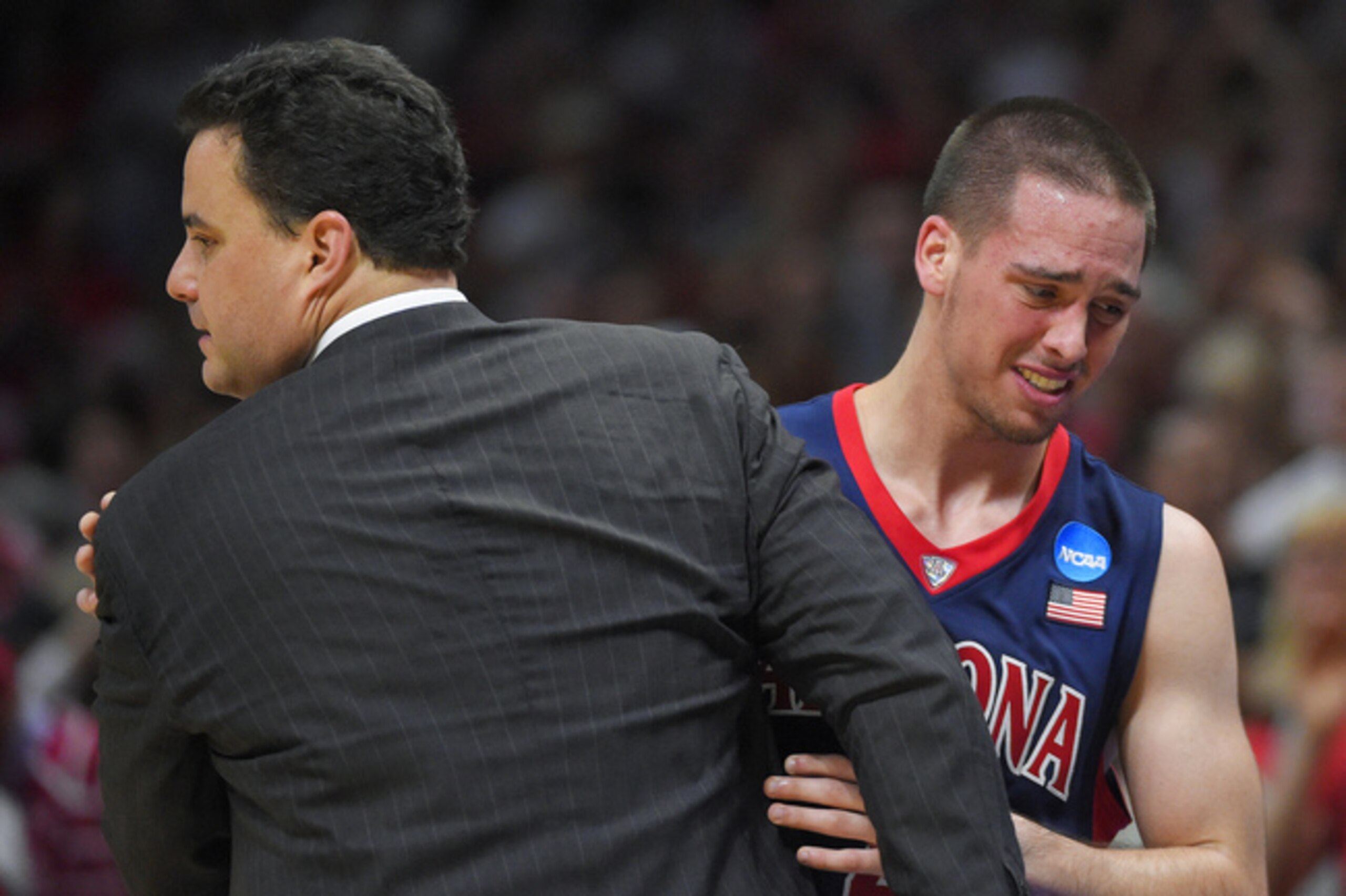 Sean Miller and T.J. McConnell as Arizona lost to Wisconsin in the NCAA tournament this year.