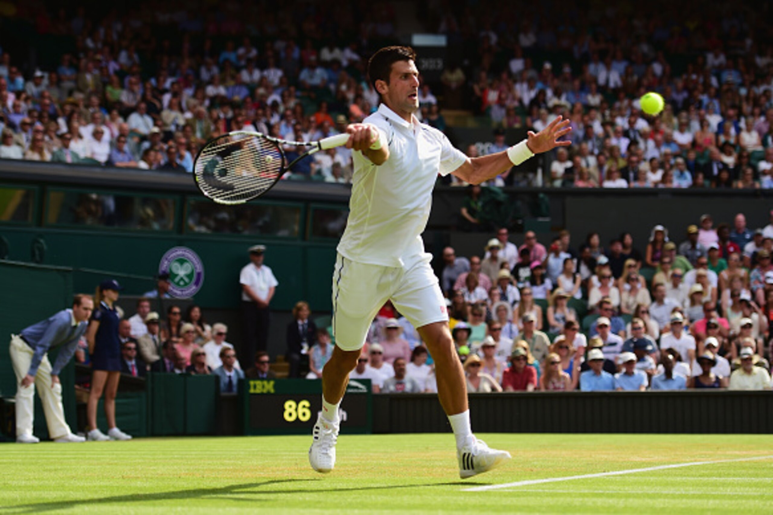 LONDON, ENGLAND - JULY 03:  Novak Djokovic of Serbia plays a forehand in his Gentlemen's Singles Third Round match against Bernard Tomic of Australia during day five of the Wimbledon Lawn Tennis Championships at the All England Lawn Tennis and Croquet Clu