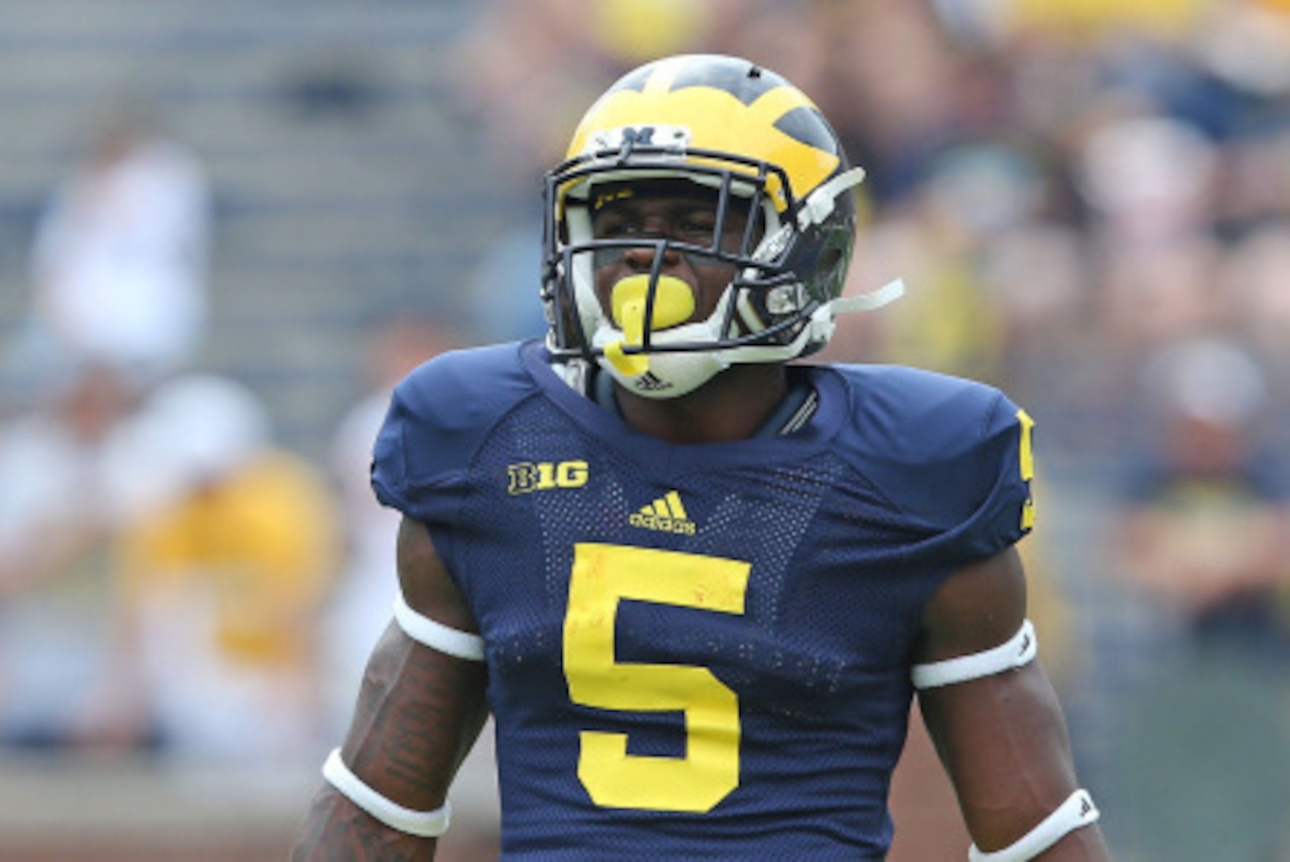 ANN ARBOR, MI - AUGUST 30: Jabrill Peppers #5 of the Michigan Wolverines warms up prior to the start of the game against the Appalachian State Mountaineers on August 30, 2014 in Ann Arbor, Michigan. The Wolverines defeated the Mountaineers 52-14. (Photo ANN ARBOR, MI - AUGUST 30: Jabrill Peppers #5 of the Michigan Wolverines warms up prior to the start of the game against the Appalachian State Mountaineers on August 30, 2014 in Ann Arbor, Michigan. The Wolverines defeated the Mountaineers 52-14. (Photo