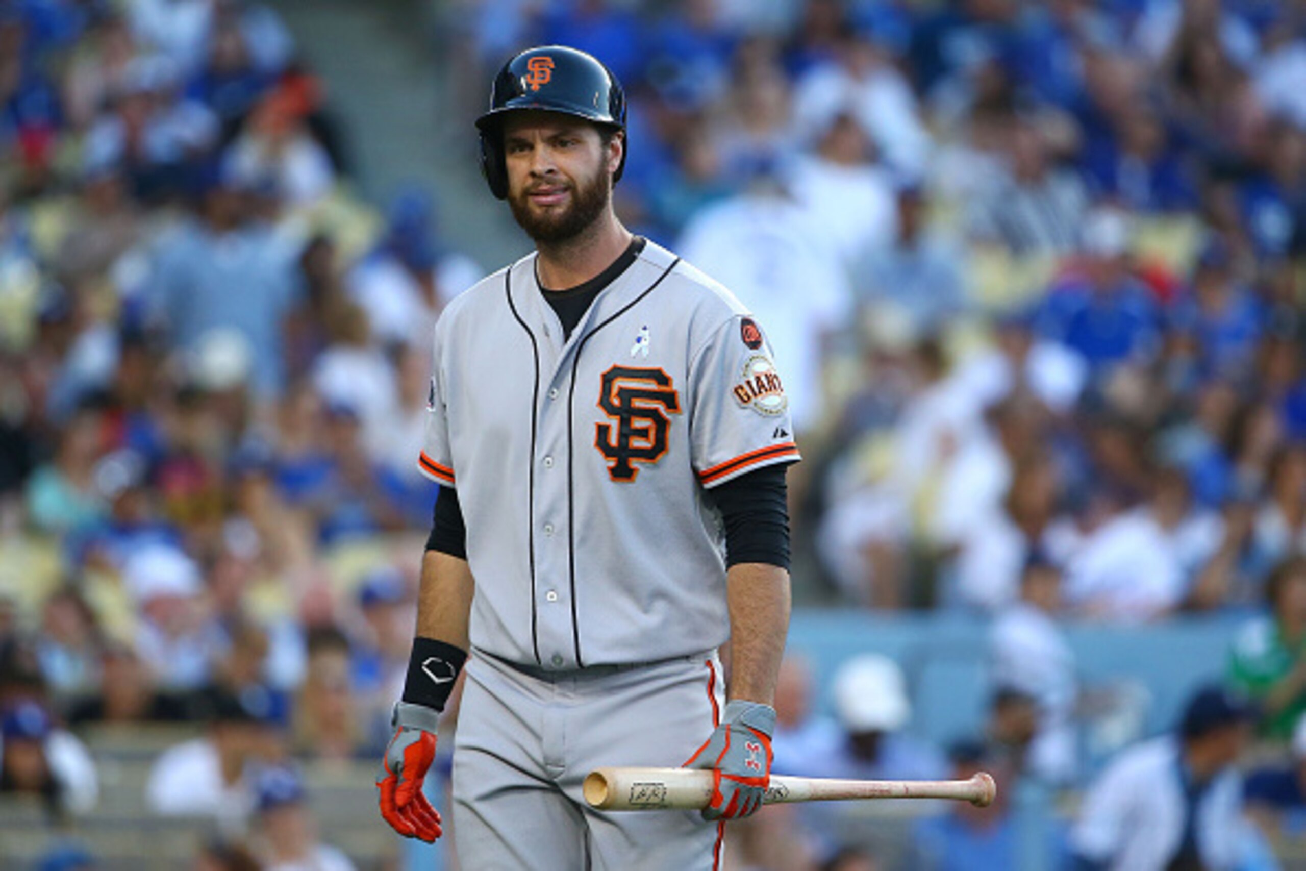 LOS ANGELES, CA - JUNE 21:  Brandon Belt #9 of the San Francisco Giants looks on after striking out in the seventh inning during the MLB game against the Los Angeles Dodgers at Dodger Stadium on June 21, 2015 in Los Angeles, California. The Dodgers defeat