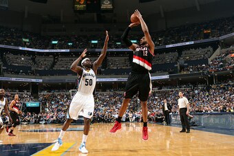 MEMPHIS, TN - APRIL 29: LaMarcus Aldridge #12 of the Portland Trail Blazers shoots against Zach Randolph #50 of the Memphis Grizzlies in Game Five of the Western Conference Quarterfinals of the NBA Playoffs at FedExForum on April 29, 2015 in Memphis, Tenn