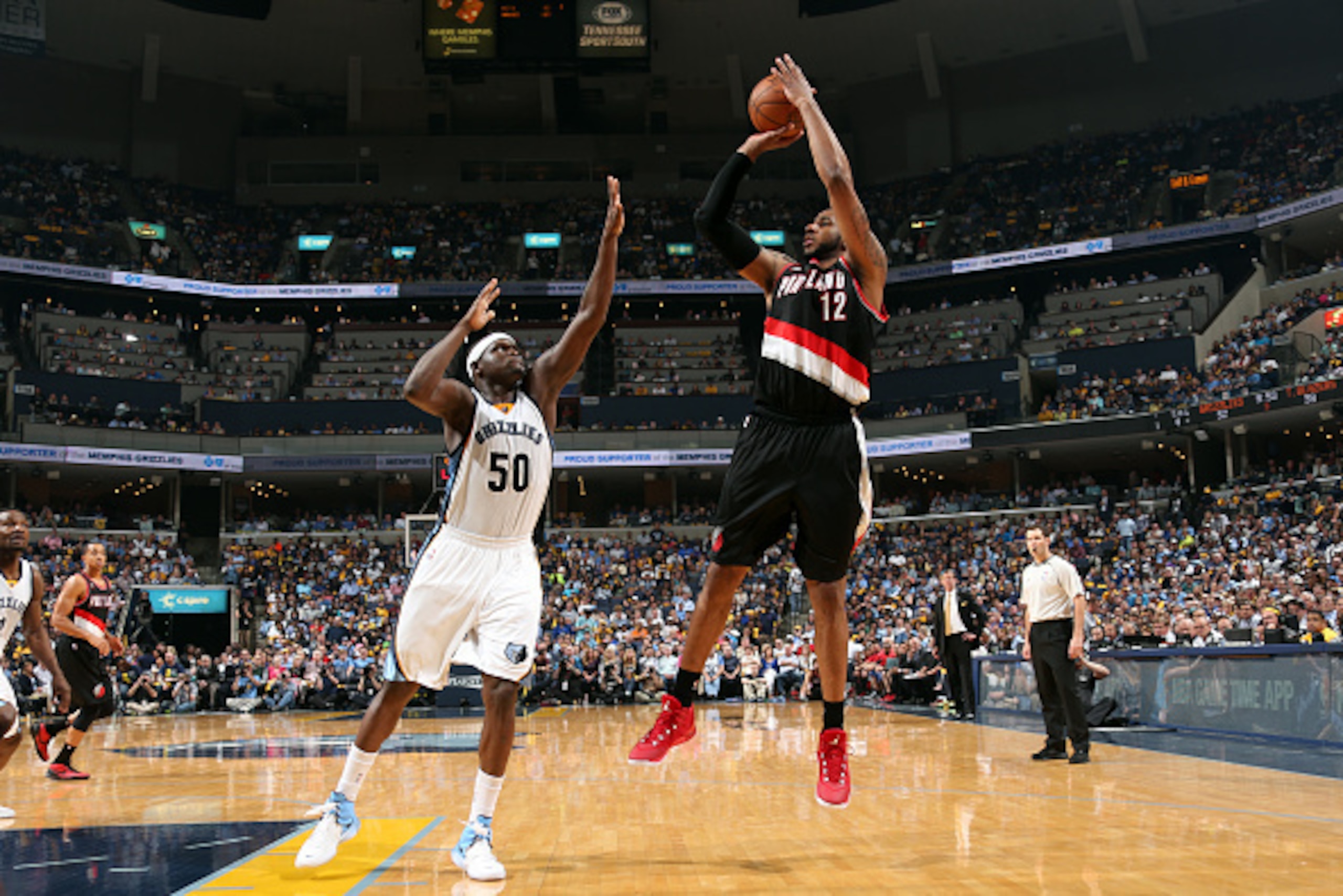 MEMPHIS, TN - APRIL 29: LaMarcus Aldridge #12 of the Portland Trail Blazers shoots against Zach Randolph #50 of the Memphis Grizzlies in Game Five of the Western Conference Quarterfinals of the NBA Playoffs at FedExForum on April 29, 2015 in Memphis, Tenn MEMPHIS, TN - APRIL 29: LaMarcus Aldridge #12 of the Portland Trail Blazers shoots against Zach Randolph #50 of the Memphis Grizzlies in Game Five of the Western Conference Quarterfinals of the NBA Playoffs at FedExForum on April 29, 2015 in Memphis, Tenn