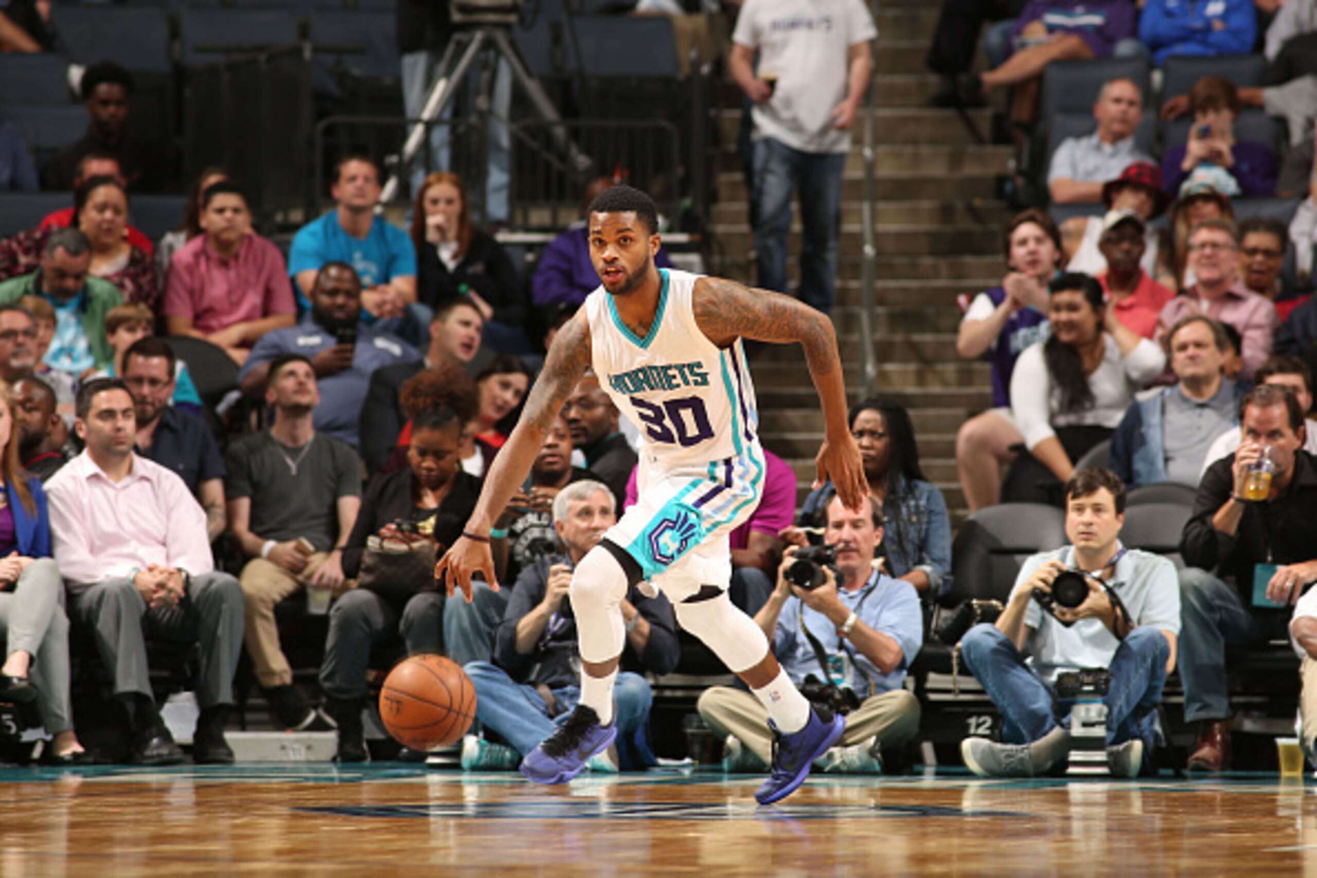 CHARLOTTE, NC - APRIL 13:  Troy Daniels #30 of the Charlotte Hornets drives against the Houston Rockets during the game at the Time Warner Cable Arena on April 13, 2015 in Charlotte, North Carolina. NOTE TO USER: User expressly acknowledges and agrees tha