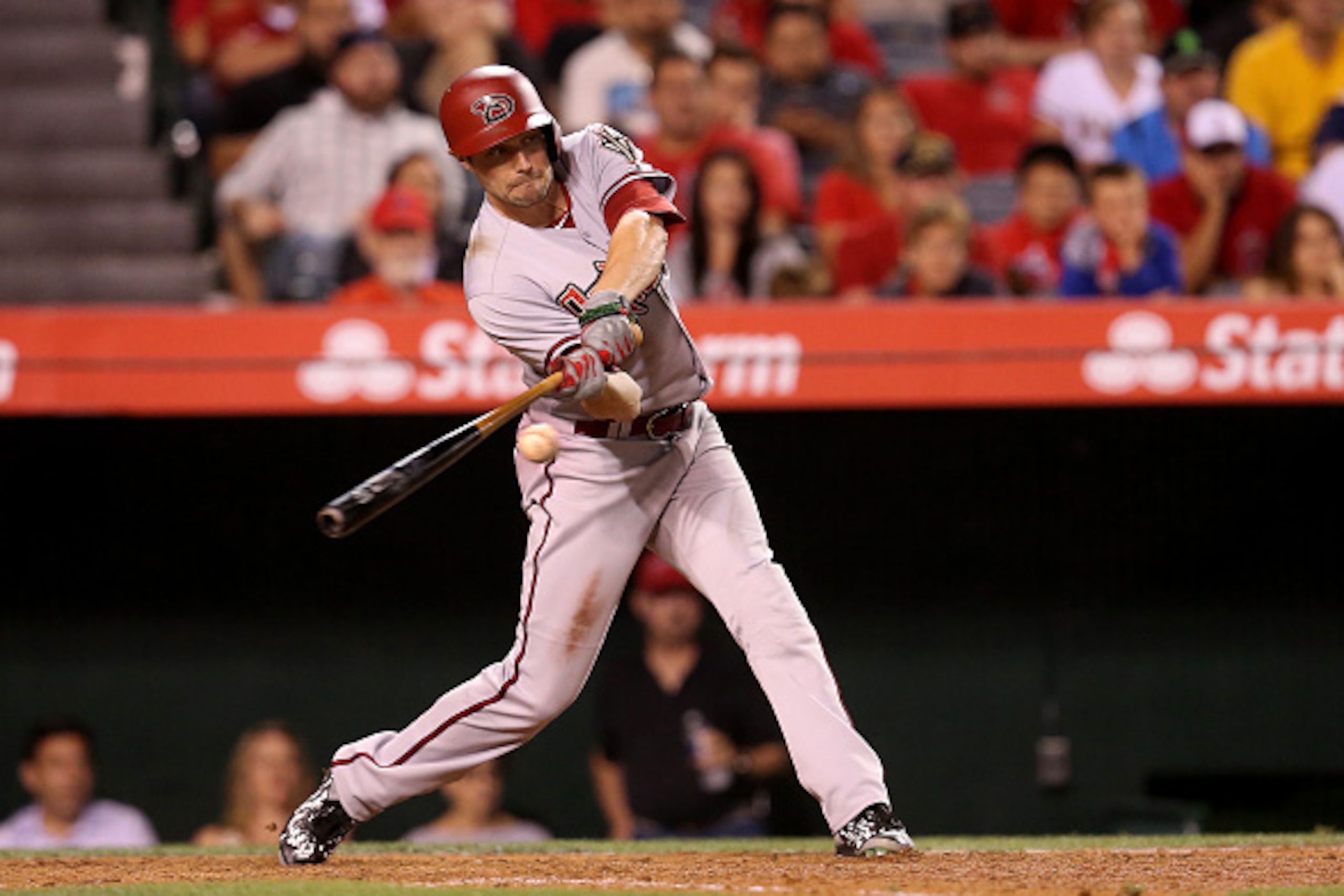 ANAHEIM, CA - JUNE 15: A.J. Pollock #11 of the Arizona Diamondbacks hits a sacrifice fly to score Nick Ahmed #13 in the ninth inning against the Los Angeles Angels of Anaheim at Angel Stadium of Anaheim on June 15, 2015 in Anaheim, California. (Photo by ANAHEIM, CA - JUNE 15: A.J. Pollock #11 of the Arizona Diamondbacks hits a sacrifice fly to score Nick Ahmed #13 in the ninth inning against the Los Angeles Angels of Anaheim at Angel Stadium of Anaheim on June 15, 2015 in Anaheim, California. (Photo by