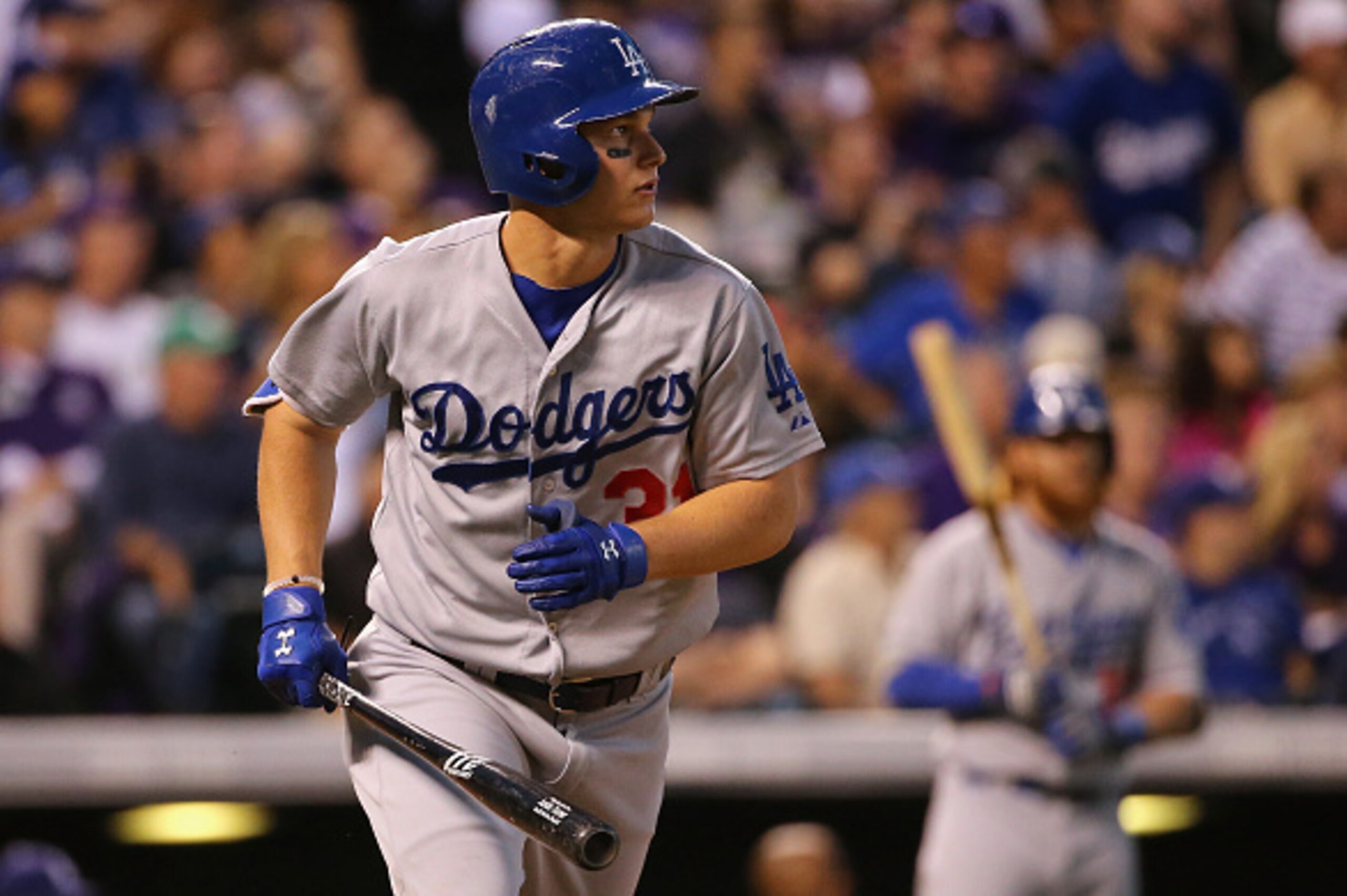 DENVER, CO - JUNE 01:  Joc Pederson #31 of the Los Angeles Dodgers watches his three run home run off of Christian Friedrich #53 of the Colorado Rockies to take a 7-2 lead over the Colorado Rockies at Coors Field on June 1, 2015 in Denver, Colorado.  (Pho