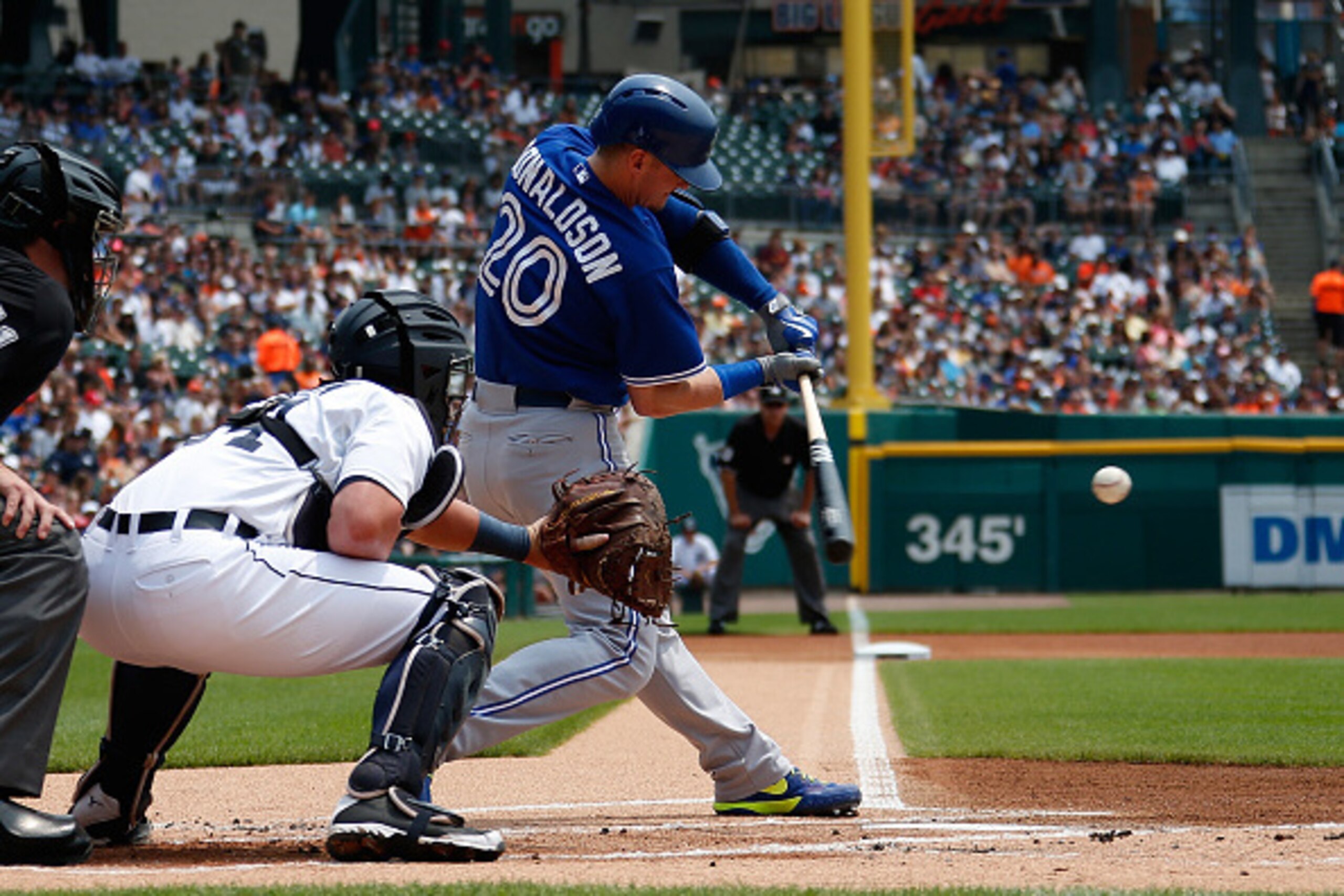 DETROIT, MI - JULY 05: Josh Donaldson #20 of the Toronto Blue Jays hits an RBI single in the first inning in front of catcher James McCann #34 of the Detroit Tigers at Comerica Park on July 5th 2015 in Detroit, Michigan. (Photo by Gregory Shamus/Getty I DETROIT, MI - JULY 05: Josh Donaldson #20 of the Toronto Blue Jays hits an RBI single in the first inning in front of catcher James McCann #34 of the Detroit Tigers at Comerica Park on July 5th 2015 in Detroit, Michigan. (Photo by Gregory Shamus/Getty I