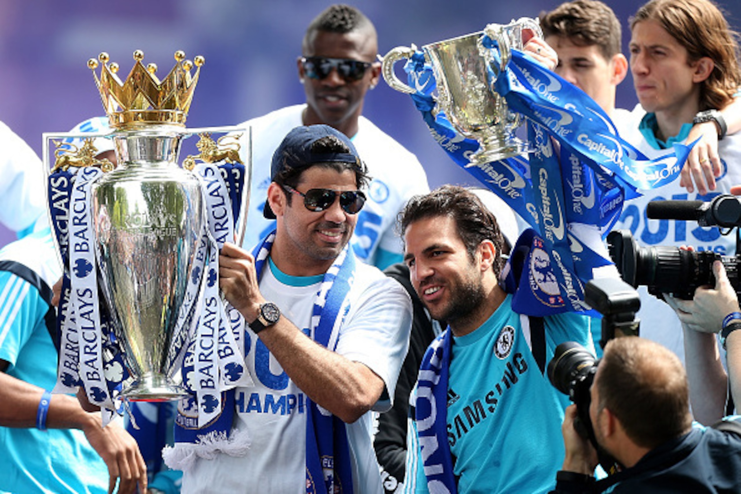 LONDON, ENGLAND - MAY 25: Diego Costa (L) and Cesc Fabregas (R) of Chelsea celebrate with the Premier League and Capital One Cup trophies duing the Chelsea FC Premier League Victory Parade on May 25, 2015 in London, England. (Photo by Ben Hoskins/Getty LONDON, ENGLAND - MAY 25: Diego Costa (L) and Cesc Fabregas (R) of Chelsea celebrate with the Premier League and Capital One Cup trophies duing the Chelsea FC Premier League Victory Parade on May 25, 2015 in London, England. (Photo by Ben Hoskins/Getty