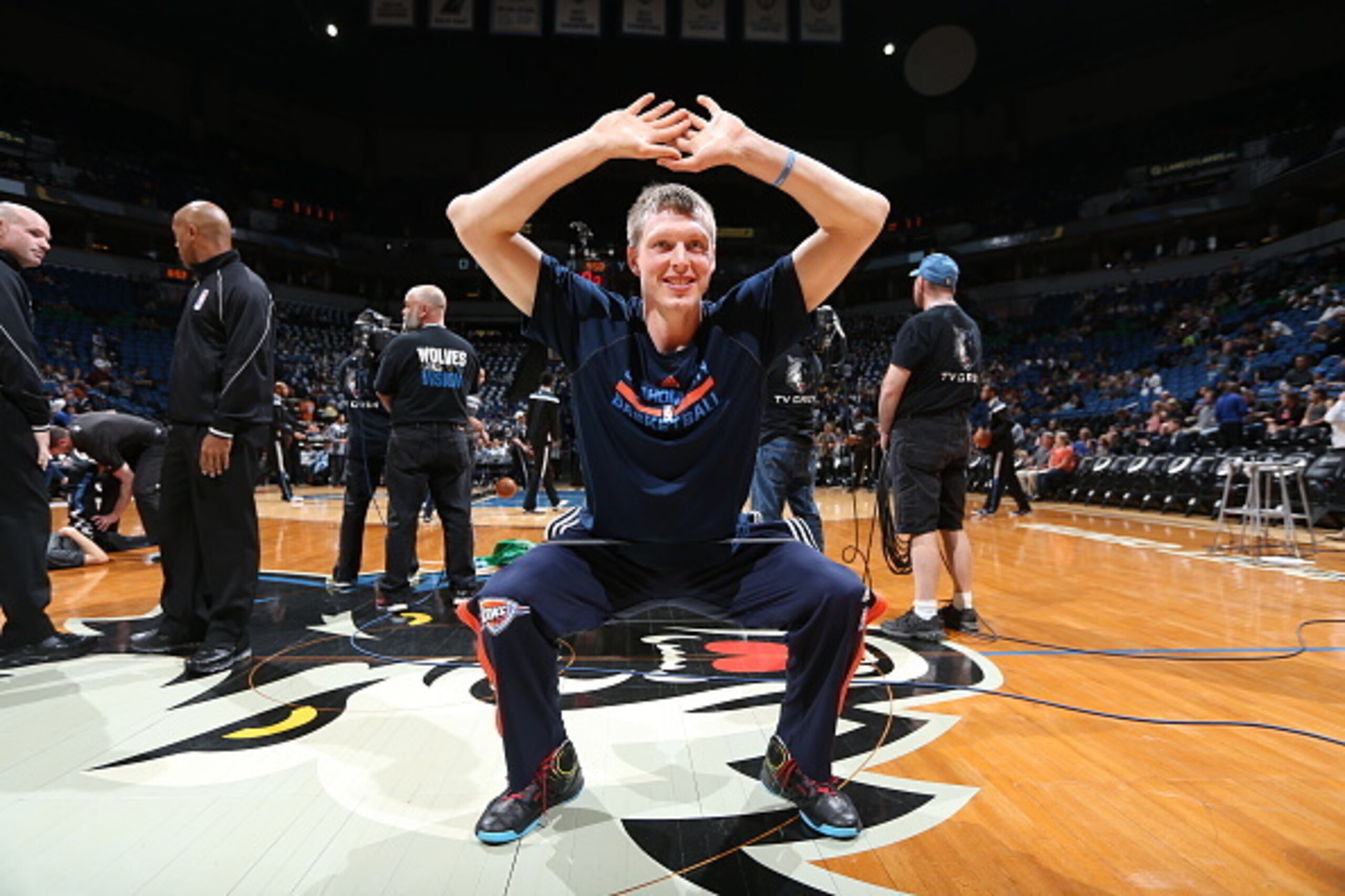 MINNEAPOLIS, MN - APRIL 15: Kyle Singler #5 of the Oklahoma City Thunder stretches before a game against the Minnesota Timberwolves on April 15, 2015 at Target Center in Minneapolis, Minnesota. NOTE TO USER: User expressly acknowledges and agrees that, by