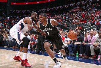 ATLANTA, GA - APRIL 22:  Joe Johnson #7 of the Brooklyn Nets drives to the basket against DeMarre Carroll #5 of the Atlanta Hawks in Game Two of the Eastern Conference Quarterfinals during the 2015 NBA Playoffs on April 22, 2015 at Philips Arena in Atlant