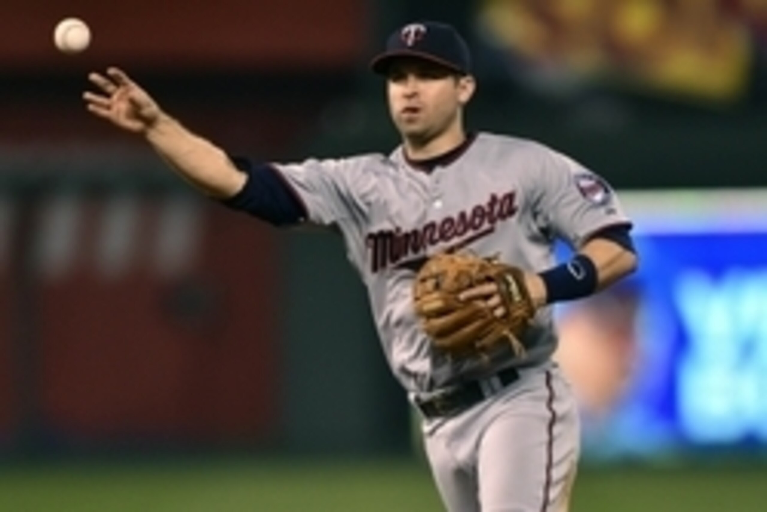 Jul 2, 2015; Kansas City, MO, USA; Minnesota Twins second basemen Brian Dozier (2) makes a throw to first for an out against the Kansas City Royals during the sixth inning at Kauffman Stadium. Mandatory Credit: Peter G. Aiken-USA TODAY Sports