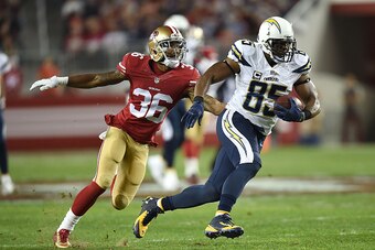 SANTA CLARA, CA - DECEMBER 20:  Antonio Gates #85 of the San Diego Chargers rushes away from Dontae Johnson #36 of the San Francisco 49ers in the second quarter at Levi's Stadium on December 20, 2014 in Santa Clara, California.  (Photo by Thearon W. Hende