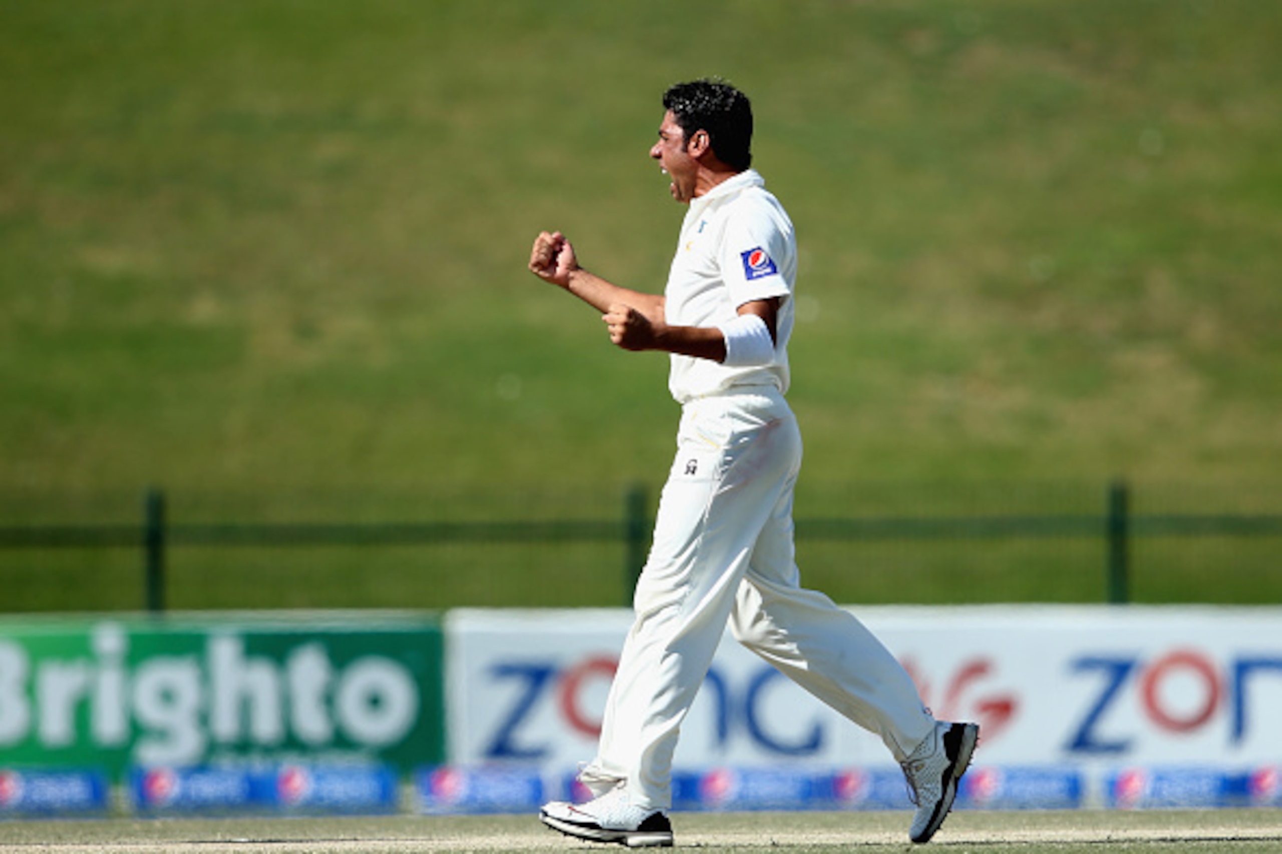 ABU DHABI, UNITED ARAB EMIRATES - NOVEMBER 13:  Imran Khan of Pakistan celebrates taking the wicket of Ish Sodhi of New Zealand during day five of the first test between Pakistan and New Zealand at Sheikh Zayed stadium on November 13, 2014 in Abu Dhabi, U