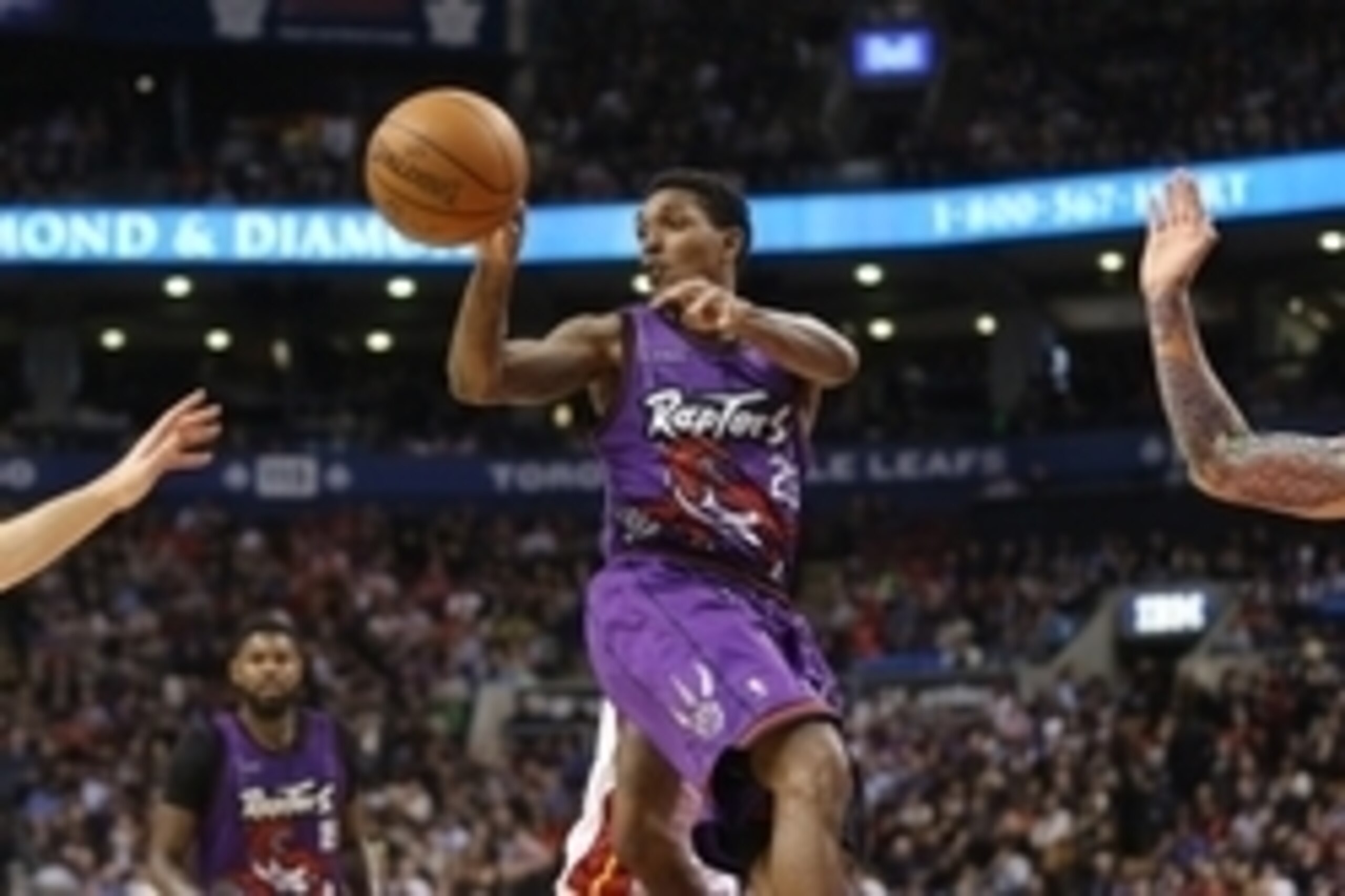 Mar 13, 2015; Toronto, Ontario, CAN; Toronto Raptors guard Lou Williams (23) passes the ball against the Miami Heat at Air Canada Centre. The Raptors beat the Heat 102-92. Mandatory Credit: Tom Szczerbowski-USA TODAY Sports