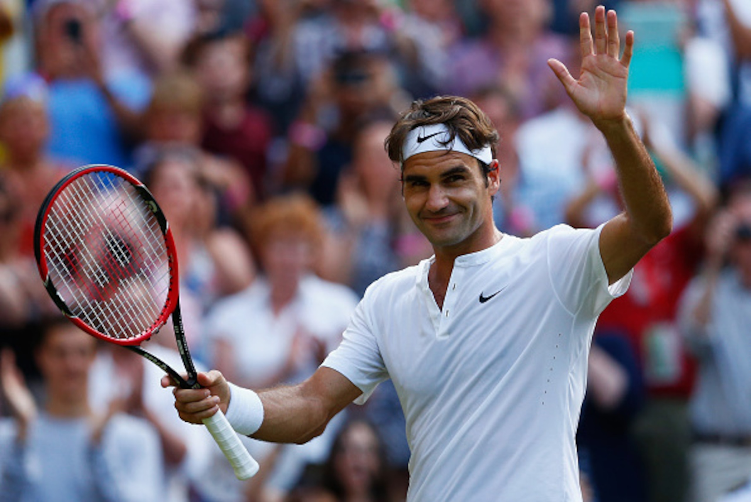 LONDON, ENGLAND - JULY 06:  Roger Federer of Switzerland waves to the crowd after victory in his Gentlemen's Singles Fourth Round match against Roberto Bautista Agut of Spain during day seven of the Wimbledon Lawn Tennis Championships at the All England L