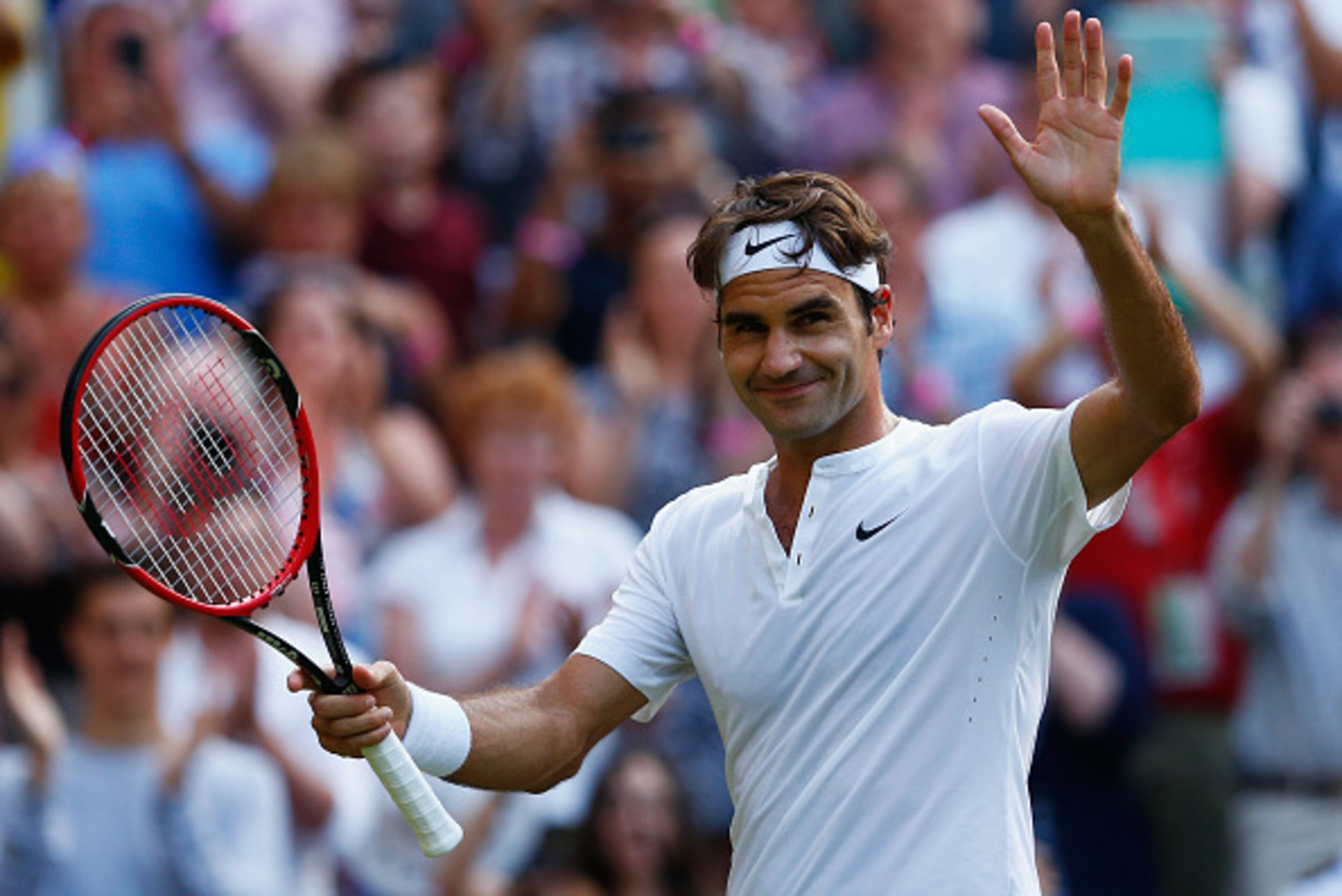 LONDON, ENGLAND - JULY 06:  Roger Federer of Switzerland waves to the crowd after victory in his Gentlemen's Singles Fourth Round match against Roberto Bautista Agut of Spain during day seven of the Wimbledon Lawn Tennis Championships at the All England L
