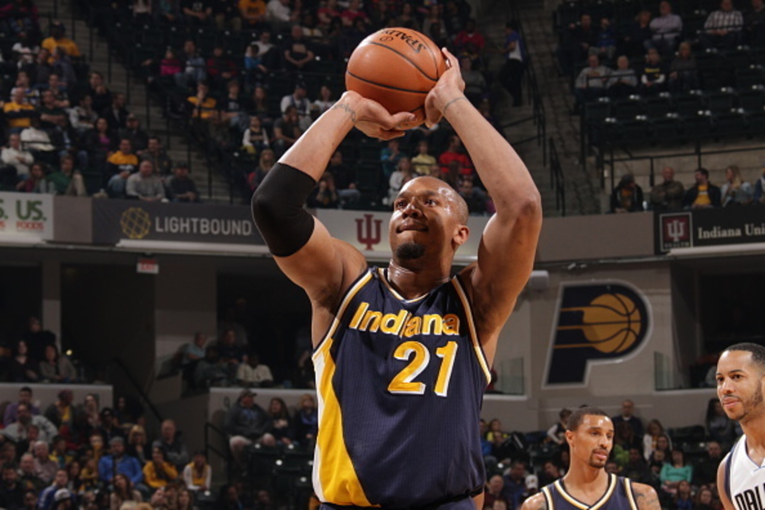 INDIANAPOLIS, IN - MARCH 29: David West #21 of the Indiana Pacers prepares to shoot a free throw against the Dallas Mavericks on March 29, 2015 at Bankers Life Fieldhouse in Indianapolis, Indiana. NOTE TO USER: User expressly acknowledges and agrees tha INDIANAPOLIS, IN - MARCH 29: David West #21 of the Indiana Pacers prepares to shoot a free throw against the Dallas Mavericks on March 29, 2015 at Bankers Life Fieldhouse in Indianapolis, Indiana. NOTE TO USER: User expressly acknowledges and agrees tha