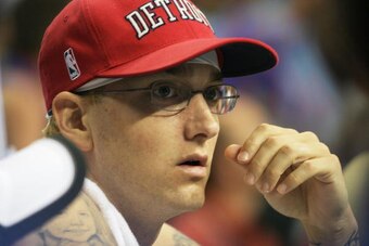 AUBURN HILLS, MI - JUNE 14:  Hip hop artist Eminem watches as the San Antonio Spurs take on the Detroit Pistons in Game three of the 2005 NBA Finals at The Palace of Auburn Hills on June 14, 2005 in Auburn Hills, Michigan.  NOTE TO USER: User expressly ac