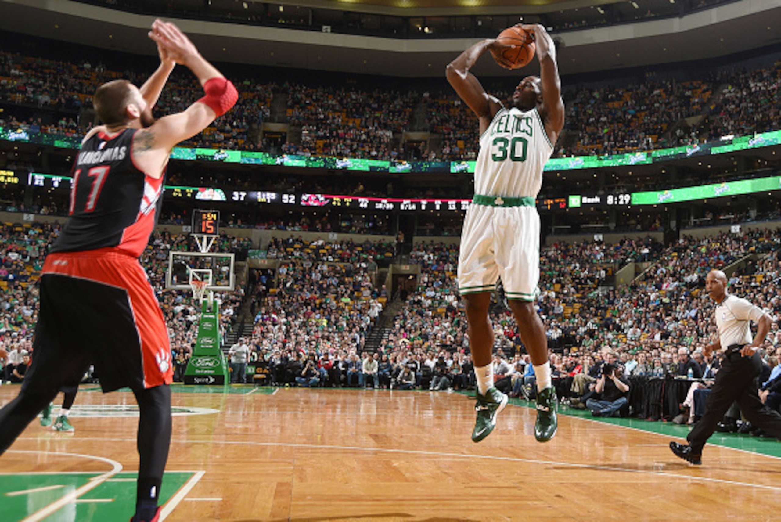 BOSTON, MA - APRIL 14:  Brandon Bass #30 of the Boston Celtics shoots against the Toronto Raptors during the game on April 14, 2015 at the TD Garden in Boston, Massachusetts. NOTE TO USER: User expressly acknowledges and agrees that, by downloading and or
