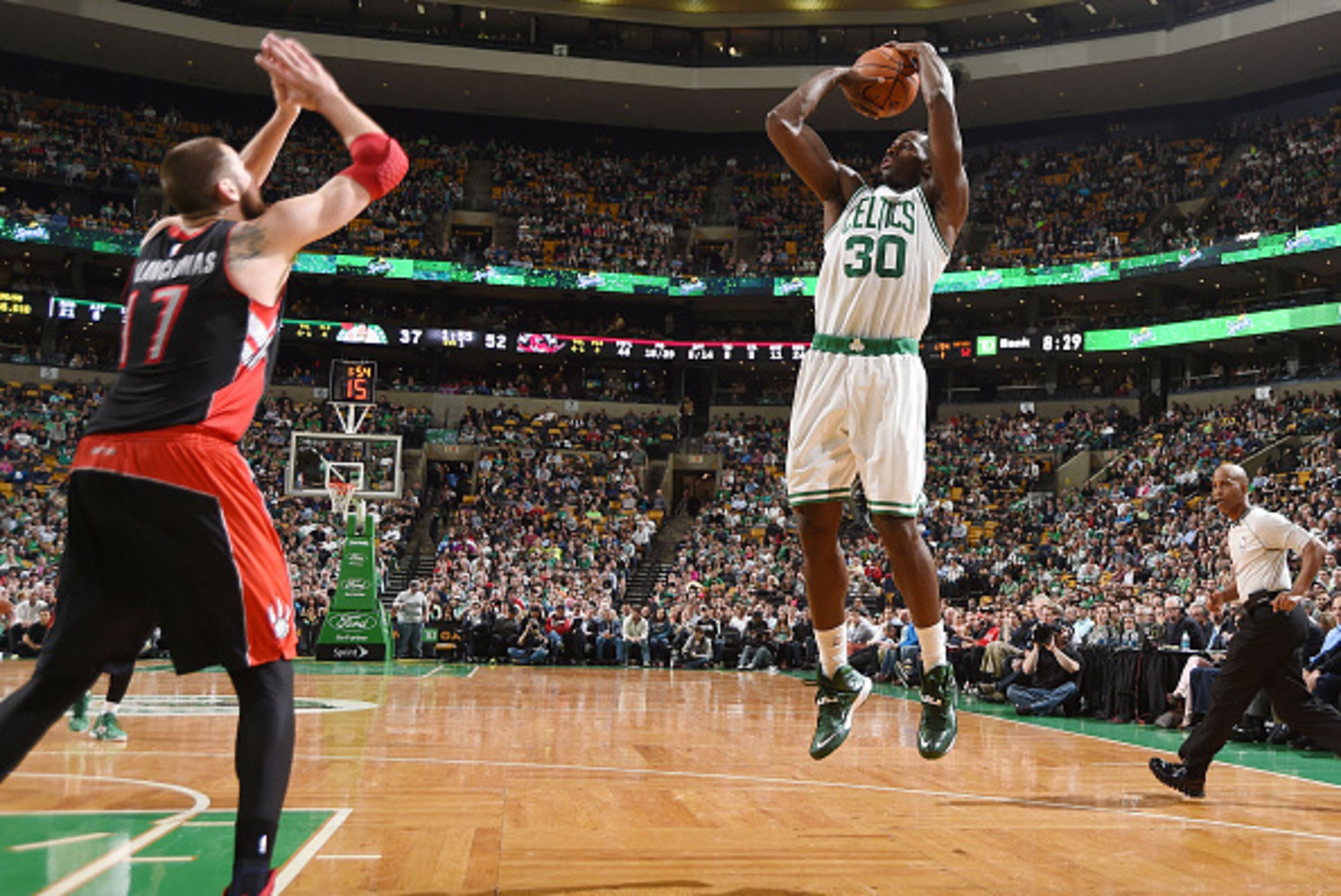 BOSTON, MA - APRIL 14:  Brandon Bass #30 of the Boston Celtics shoots against the Toronto Raptors during the game on April 14, 2015 at the TD Garden in Boston, Massachusetts. NOTE TO USER: User expressly acknowledges and agrees that, by downloading and or
