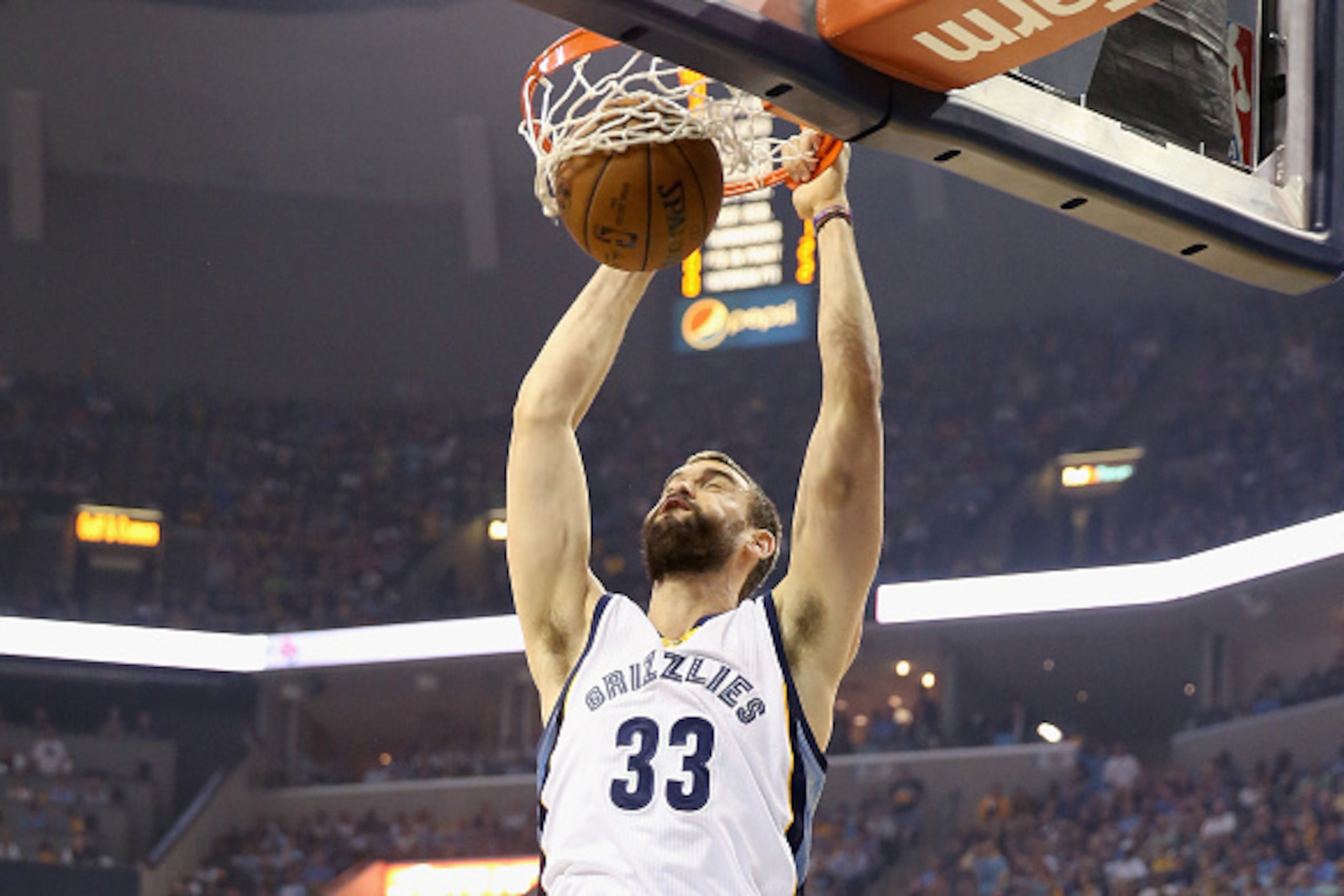 MEMPHIS, TN - MAY 11: Marc Gasol #33 of the Memphis Grizzlies dunks the ball against the Golden State Warriors during Game four of the Western Conference Semifinals of the 2015 NBA Playoffs at FedExForum on May 11, 2015 in Memphis, Tennessee. NOTE TO US MEMPHIS, TN - MAY 11: Marc Gasol #33 of the Memphis Grizzlies dunks the ball against the Golden State Warriors during Game four of the Western Conference Semifinals of the 2015 NBA Playoffs at FedExForum on May 11, 2015 in Memphis, Tennessee. NOTE TO US