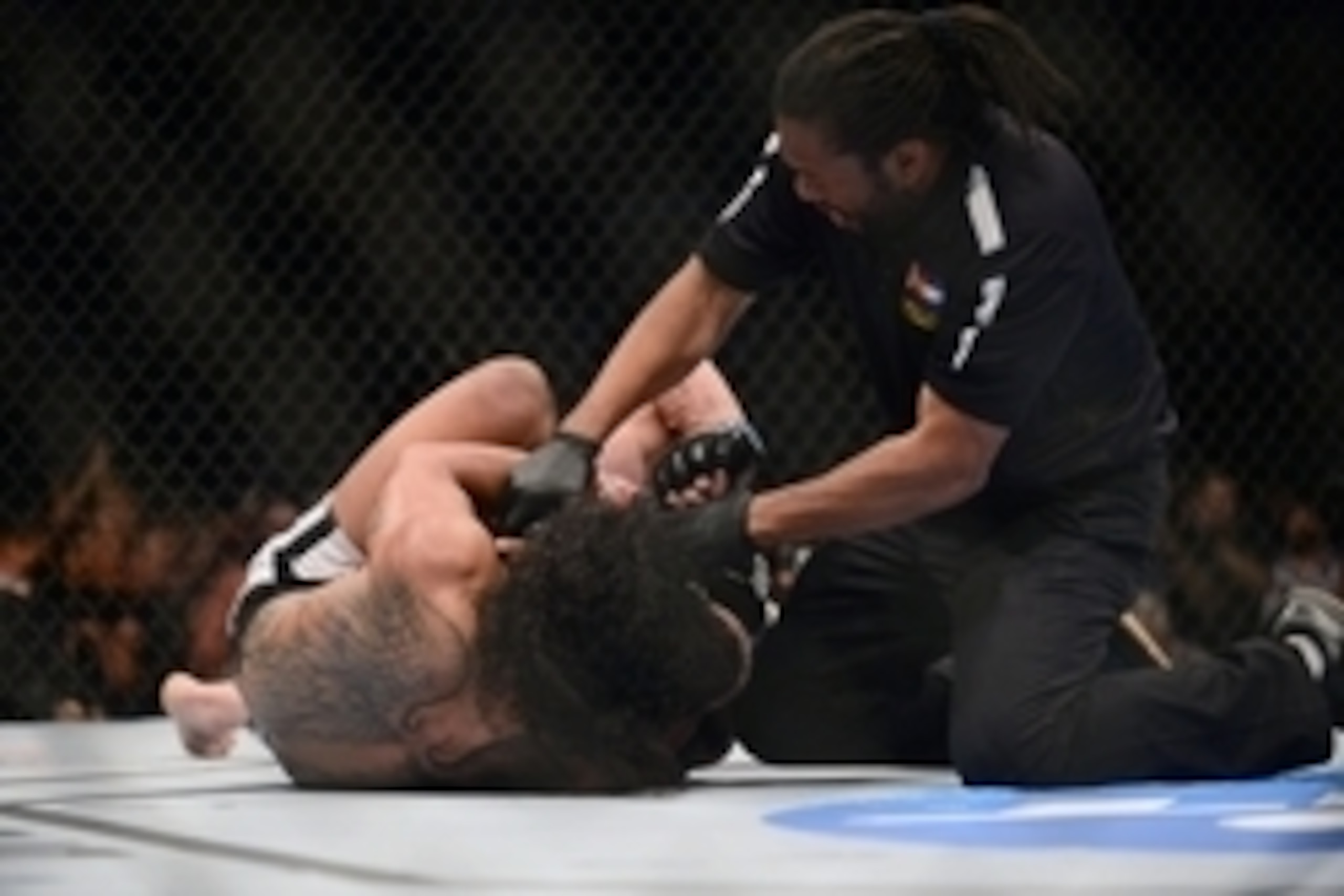Feb 14, 2015; Broomfield, CO, USA; UFC referee Herb Dean stops the fight between Brandon Thatch (blue) and Benson Henderson (red) in the welterweight bout at the UFC Fight Night at the 1stBANK Center. Mandatory Credit: Ron Chenoy-USA TODAY Sports Feb 14, 2015; Broomfield, CO, USA; UFC referee Herb Dean stops the fight between Brandon Thatch (blue) and Benson Henderson (red) in the welterweight bout at the UFC Fight Night at the 1stBANK Center. Mandatory Credit: Ron Chenoy-USA TODAY Sports