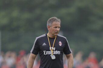 Sinisa Mihajlovic, here supervising his first training session at Milanello, aims to bring back a positive style to Milan's play.