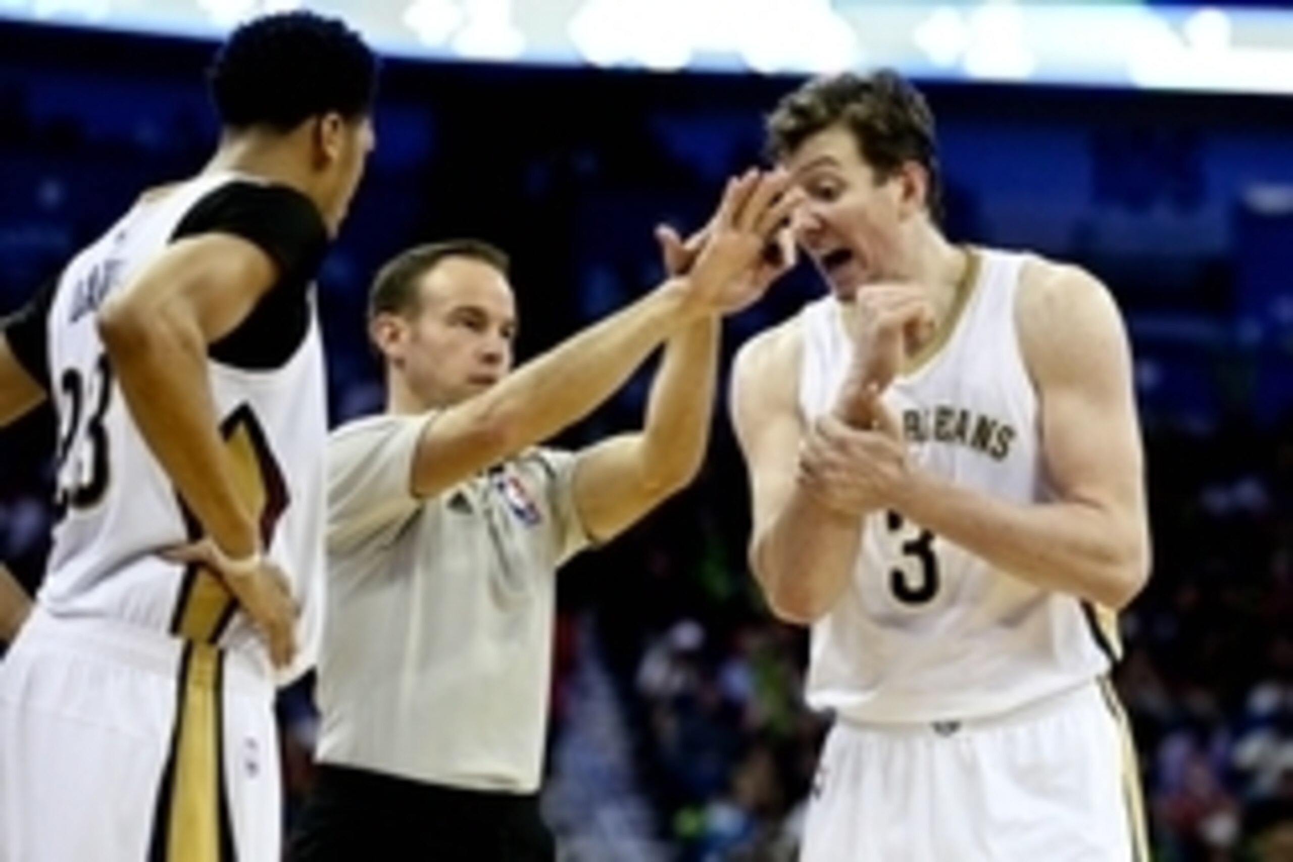 Apr 7, 2015; New Orleans, LA, USA; New Orleans Pelicans center Omer Asik (3) and forward Anthony Davis (23) argue a call with an official during a game at the Smoothie King Center. The Pelicans defeated the Warriors 103-100. Mandatory Credit: Derick E. Hi