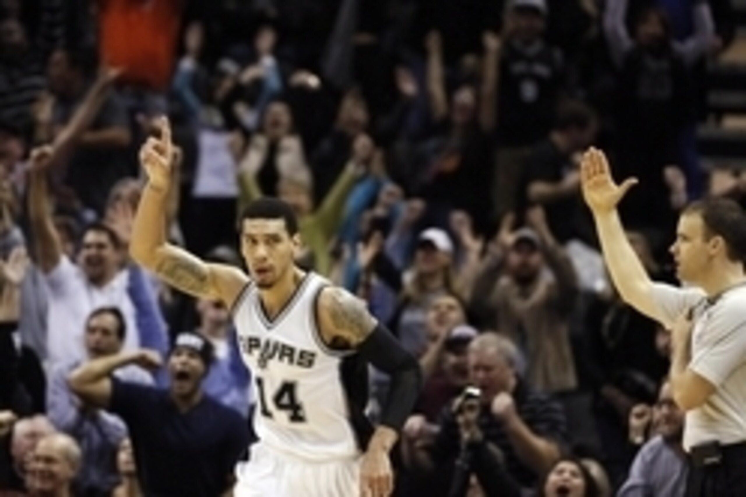 Dec 17, 2014; San Antonio, TX, USA; San Antonio Spurs shooting guard Danny Green (14) reacts after a shot against the Memphis Grizzlies during the second half at AT&T Center. The Grizzlies won 117-116 in triple overtimeMandatory Credit: Soobum Im-USA TODA