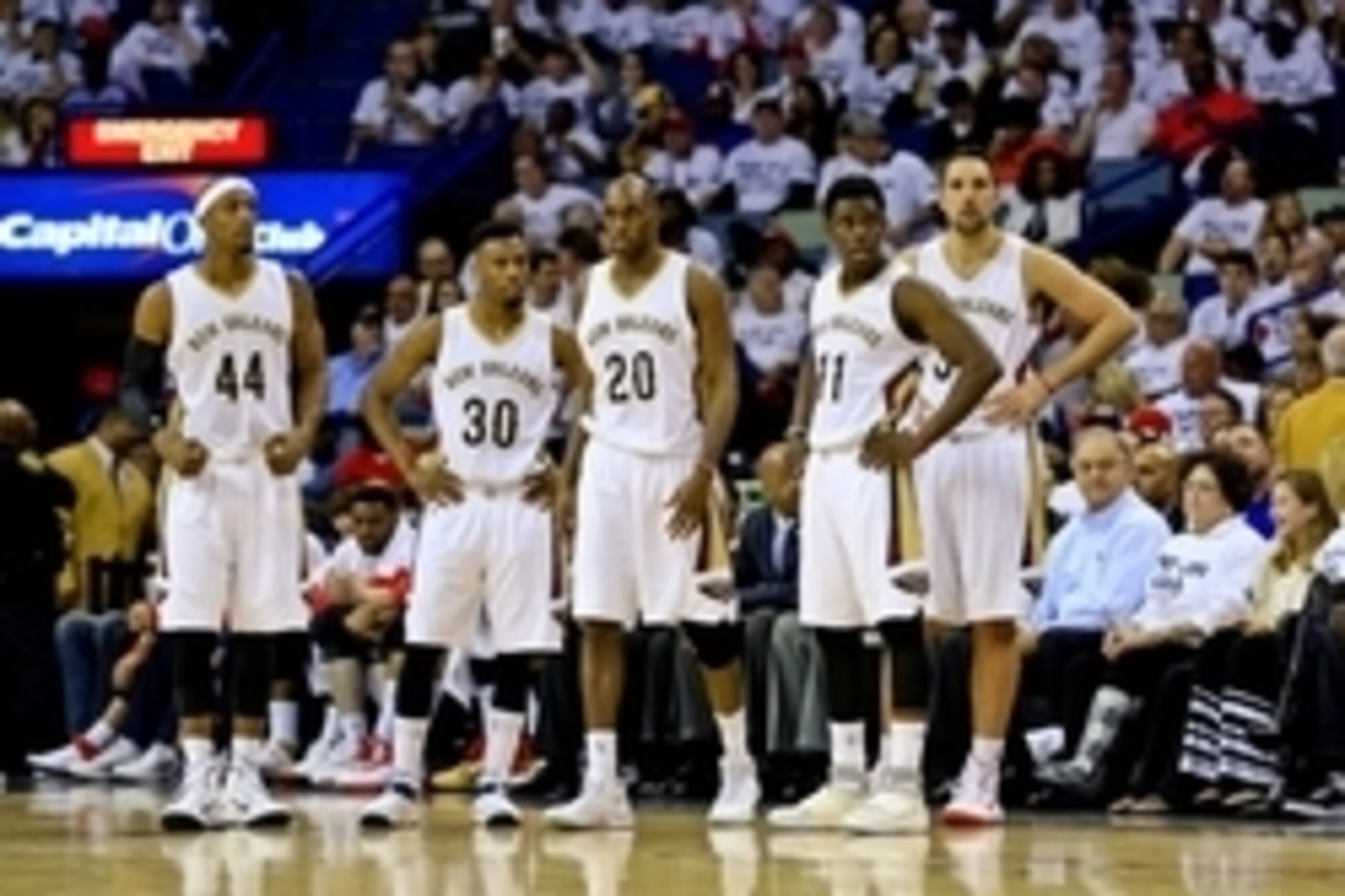 Apr 25, 2015; New Orleans, LA, USA; New Orleans Pelicans players Dante Cunningham (44) and Norris Cole (30) and Quincy Pondexter (20) and Jrue Holiday (11) and Ryan Anderson (33) wait to enter the game at the start of the fourth quarter in game four of th